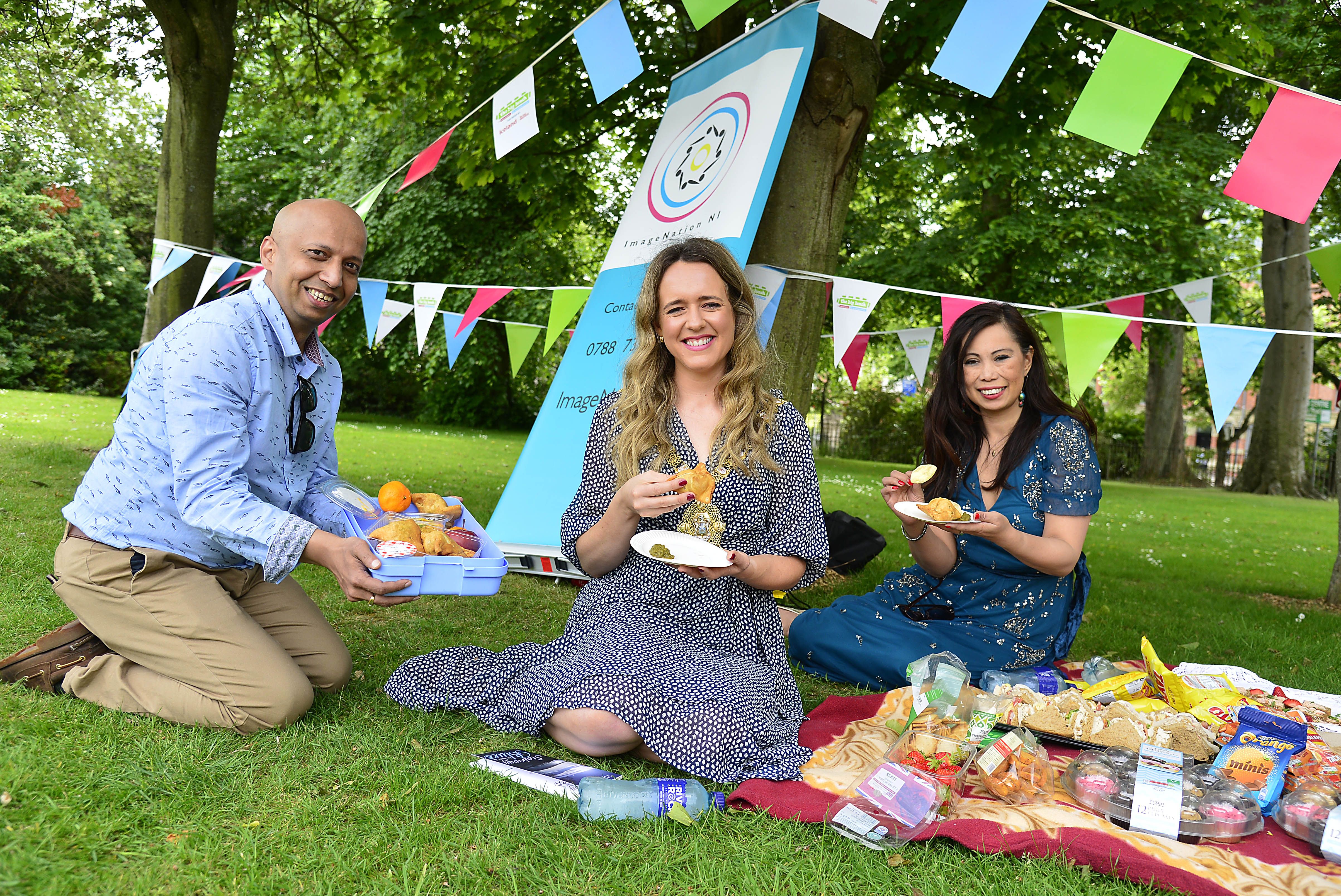 Sanjay Ghosh (Founder ImageNationNI), Lord Mayor Councillor Kate Nicholl and Eileen Chan-Hu (CRAIC NI) celebrate a Big Lunch get together at Ormeau Park