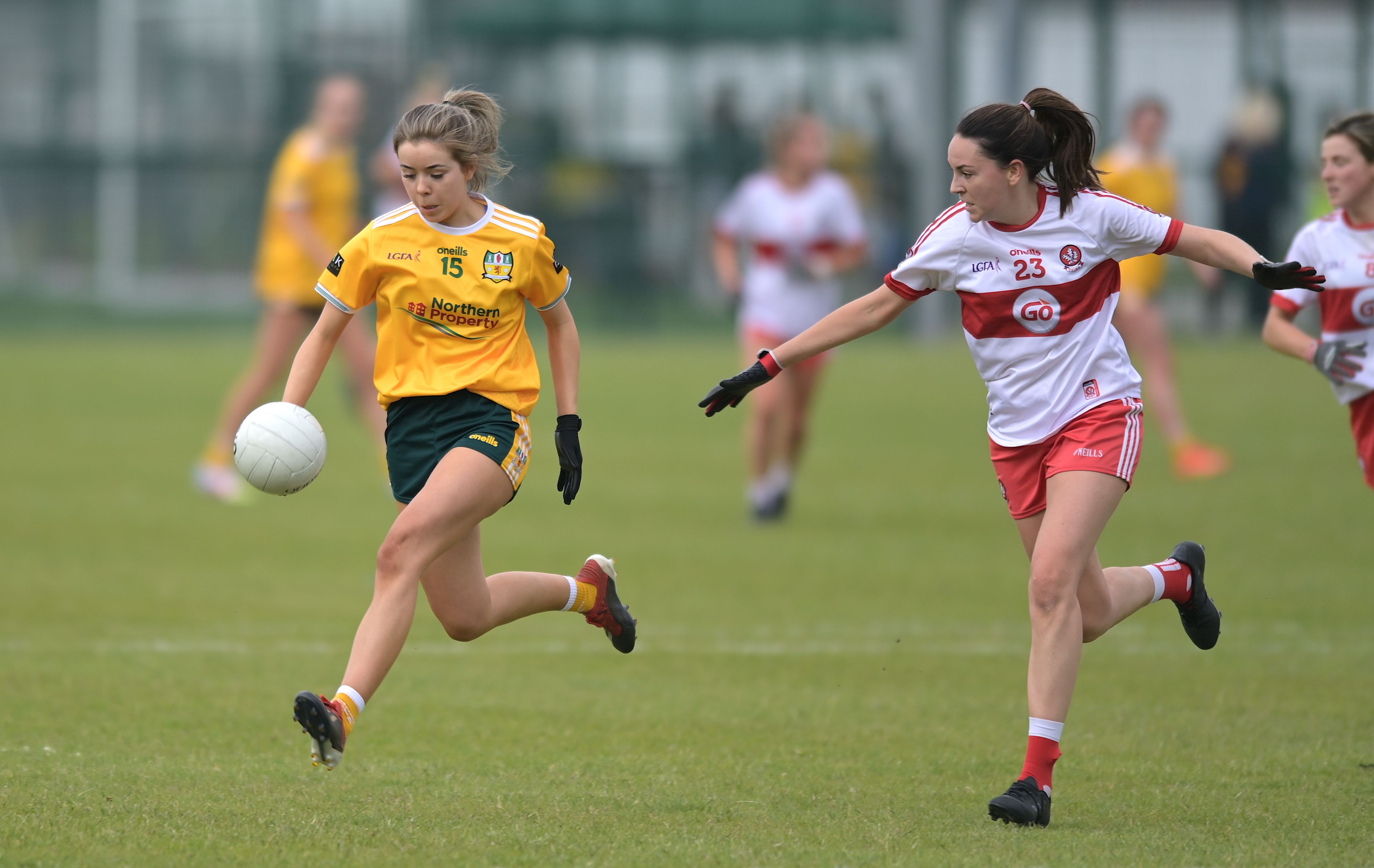 Antrim's Aoife Taggart breaks clear of Derry's Caoimhe Kirkpatrick