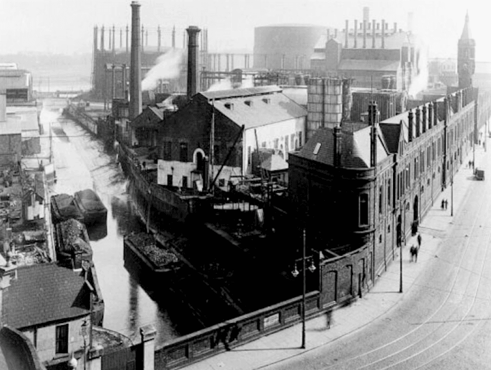 Picture 1935.  The Belfast Gasworks as seen from the bottom of the Ormeau Road, with the Blackstaff River on the left. Anonymous Unknown author, Public domain, via Wikimedia Commons