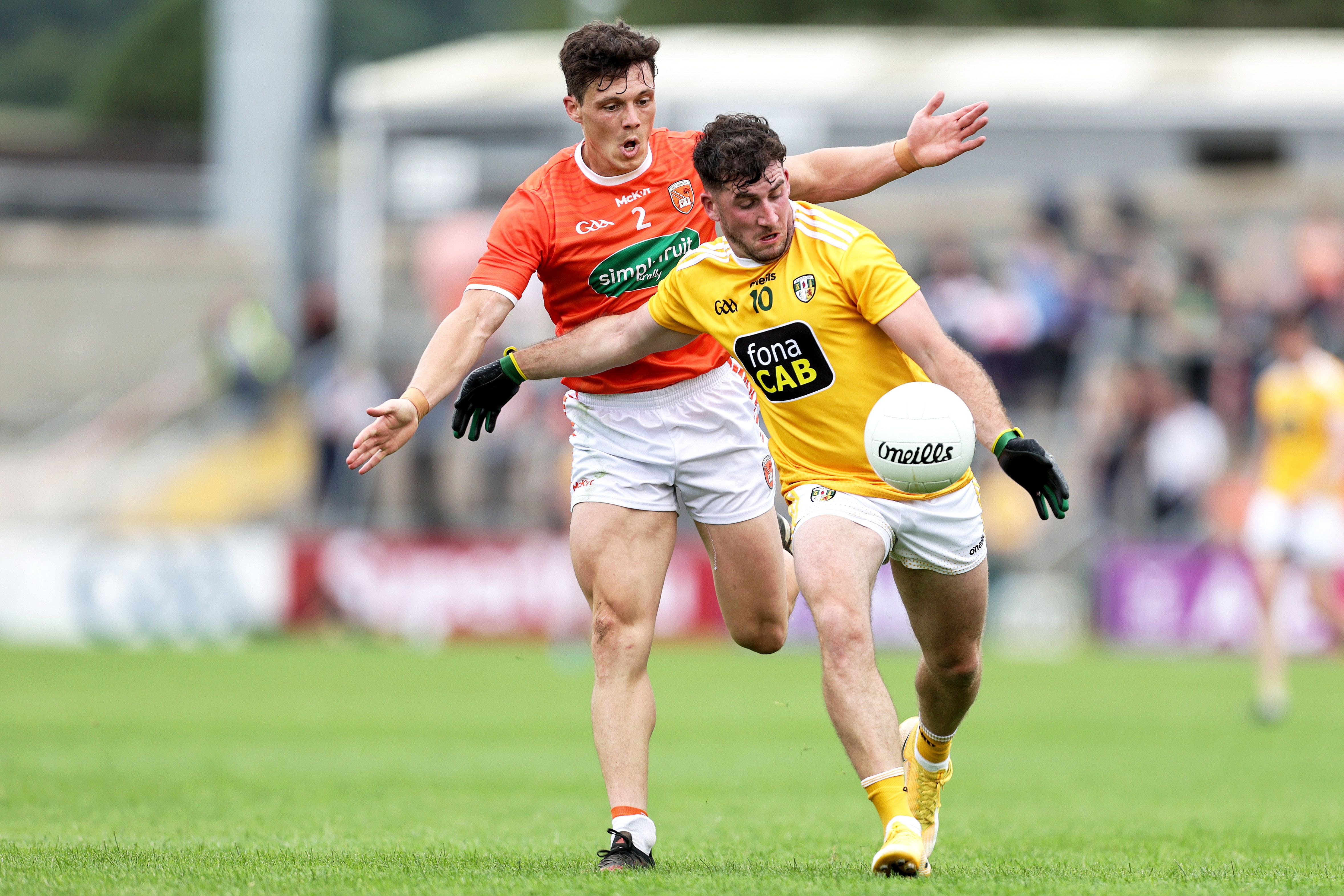 Antrim's Ryan Murray comes under pressure from Armagh defender James Morgan