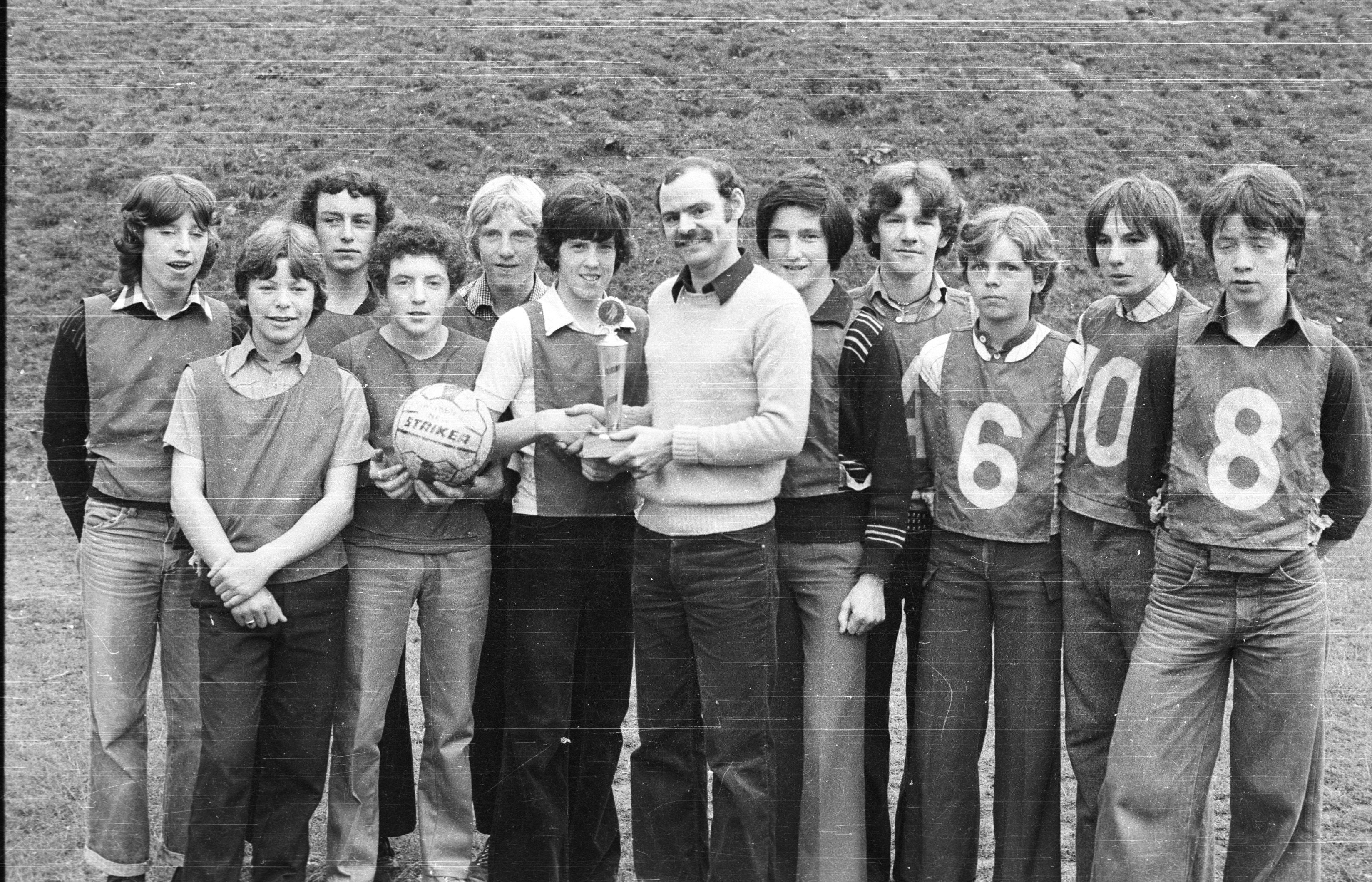 Martin Tohill presents the FTA Trophy to Brian Robinson, 5-a-side captain, at Summer Recreation Scheme, St Paul's School, Beechmount