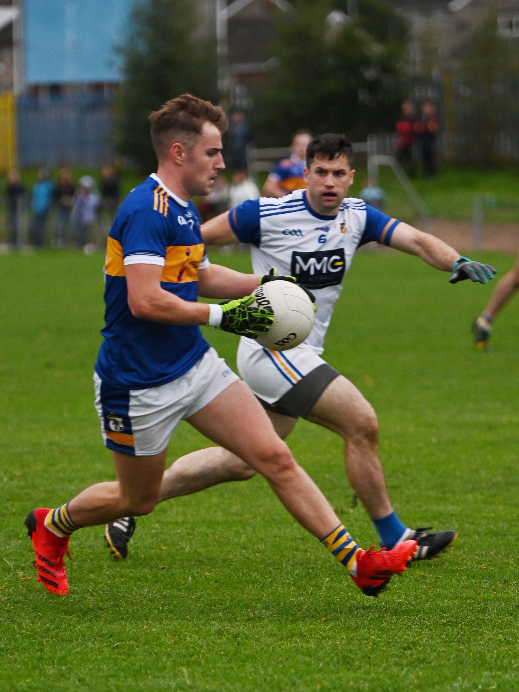 Dominic McEnhill gets away from Fearghal Duffin