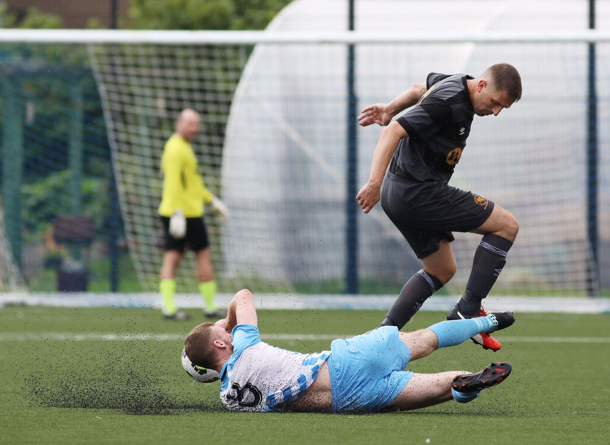 Martin Bradley slides in to make a challenge