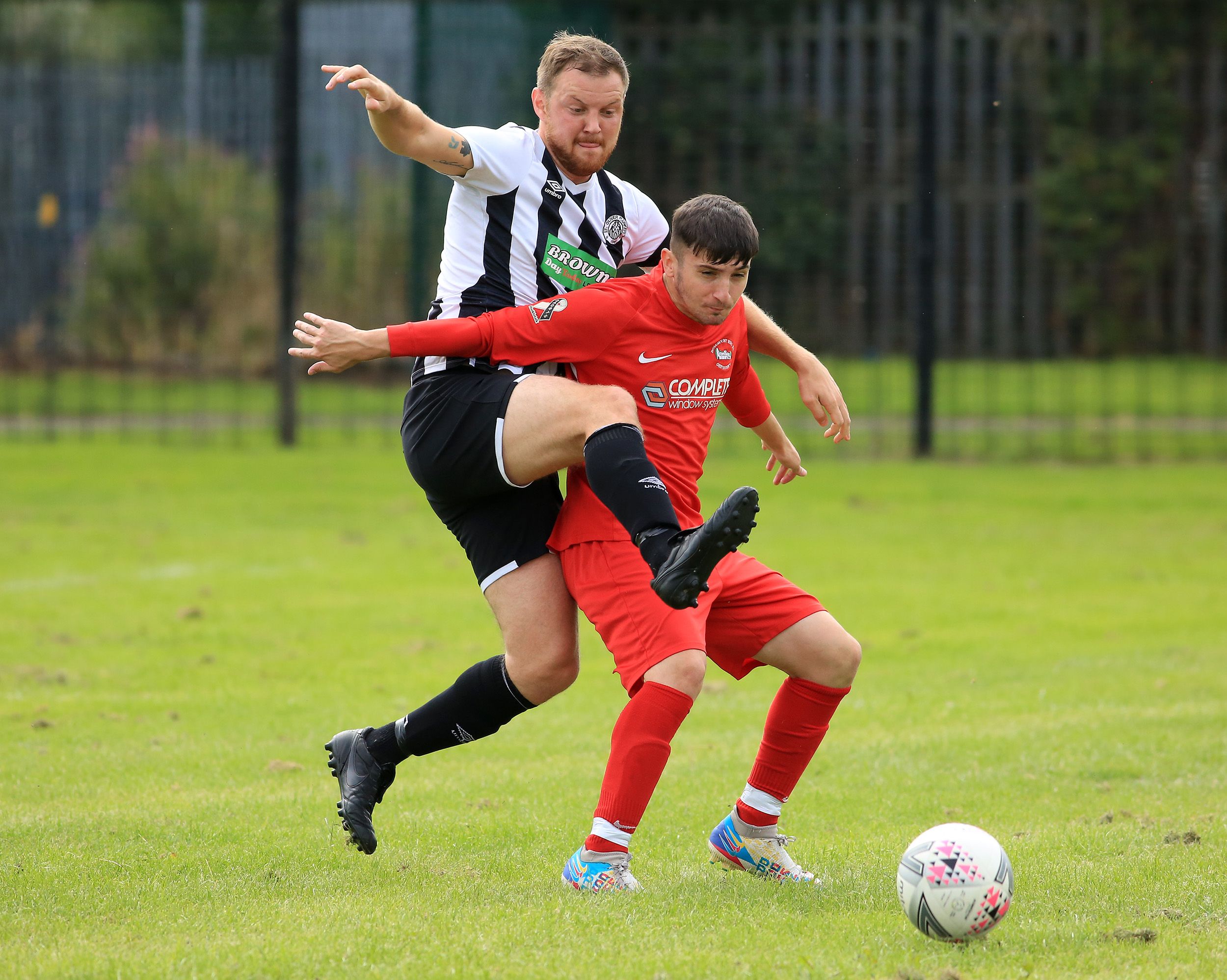 Plunkett captain Michael Healy challenges Curtis Giltrap