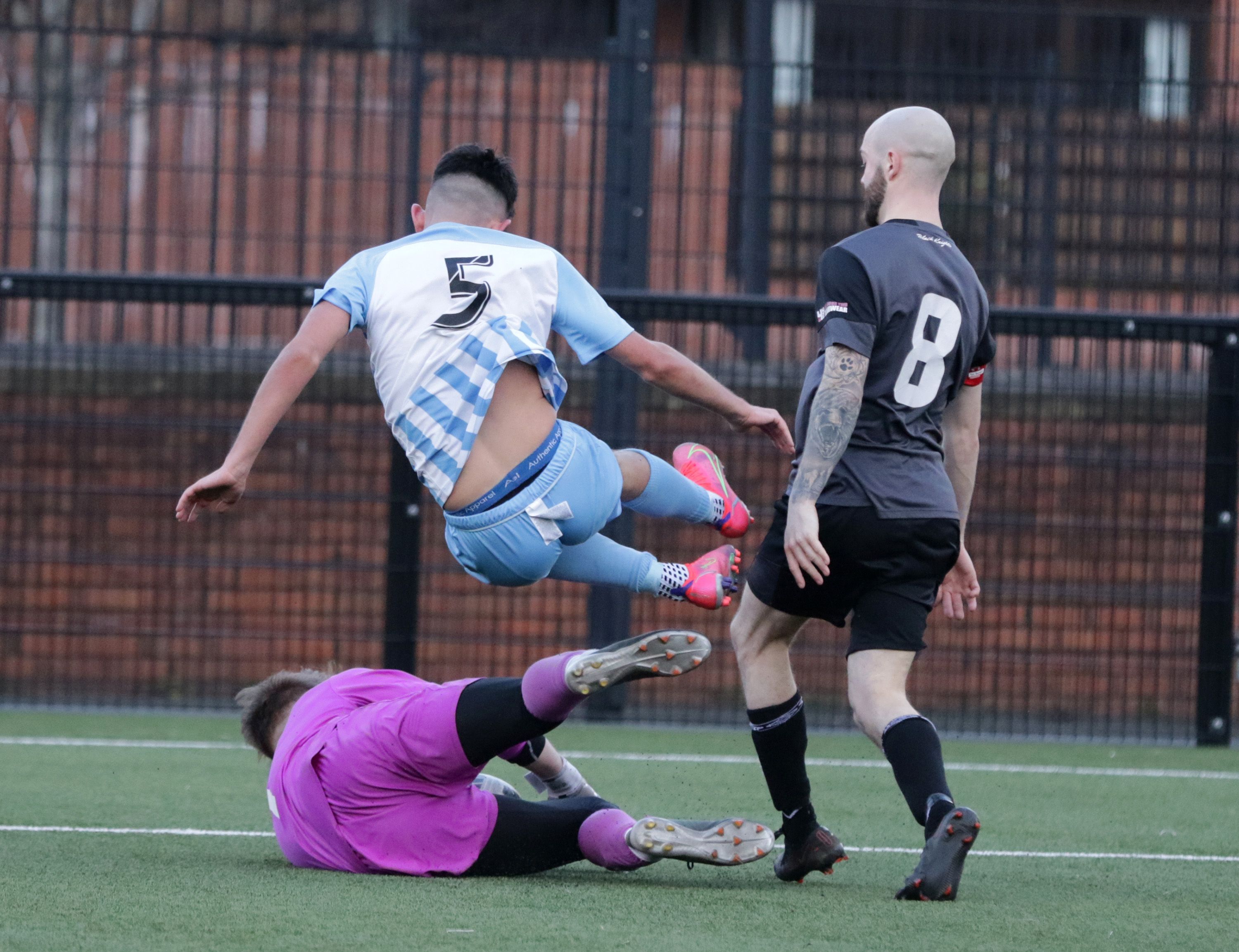 1st Bangor OB goalkeeper Alistair McVeigh gets there ahead of Ben McCaul