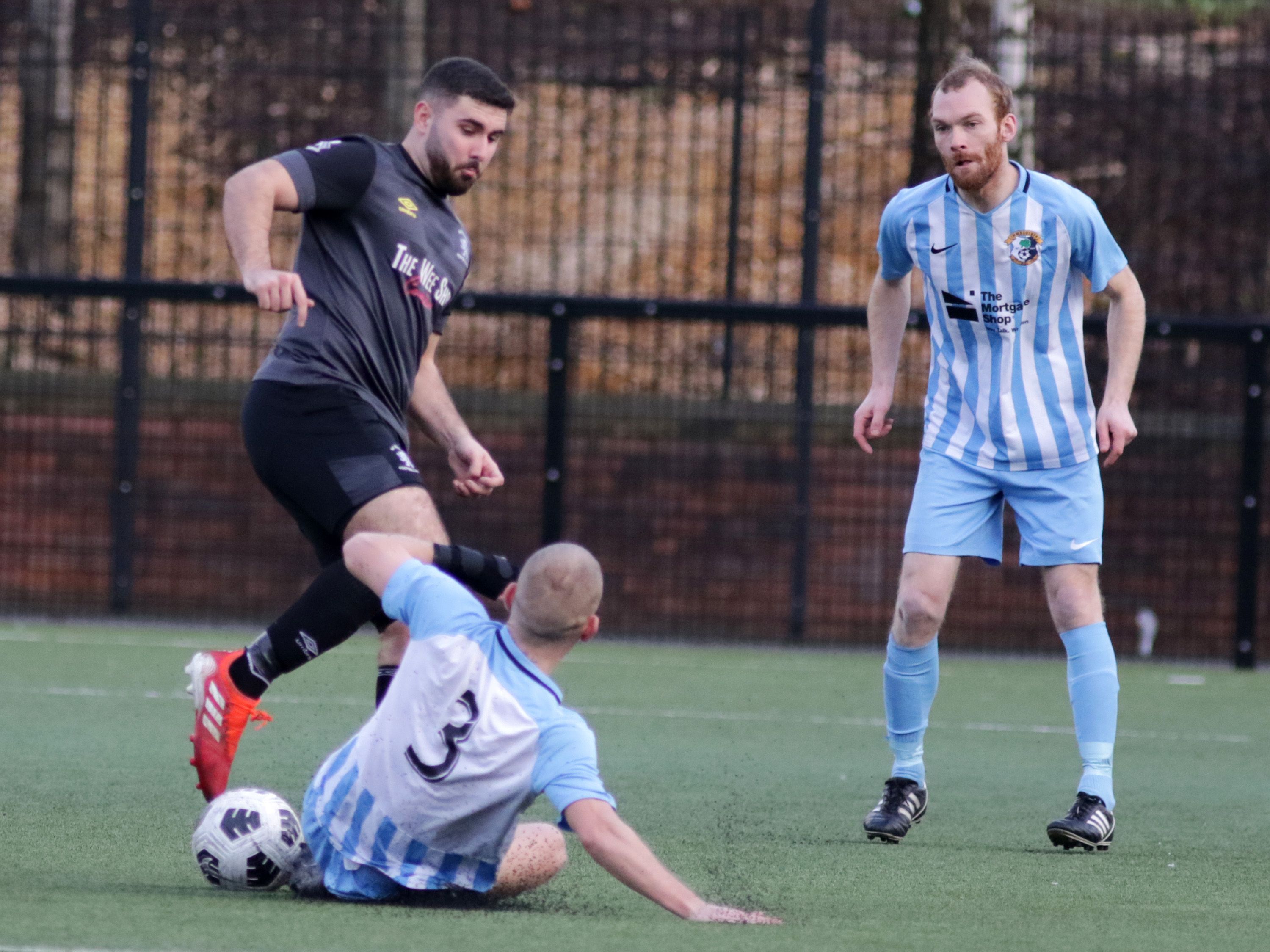 Michael Fisher slides in to make a challenge