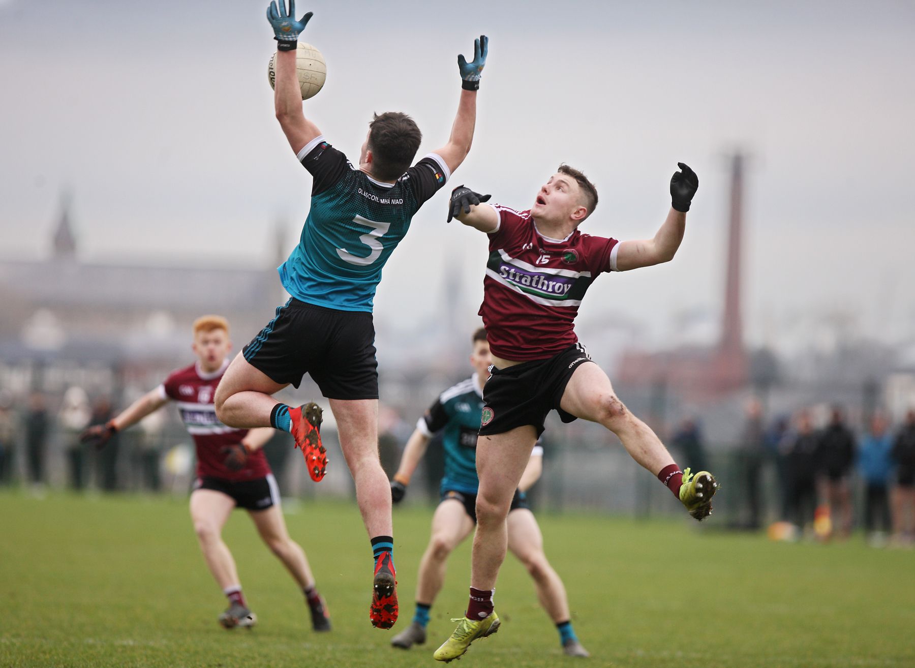 maynooth's Ciaran Dolan is challenged in the air by Cormac Murphy