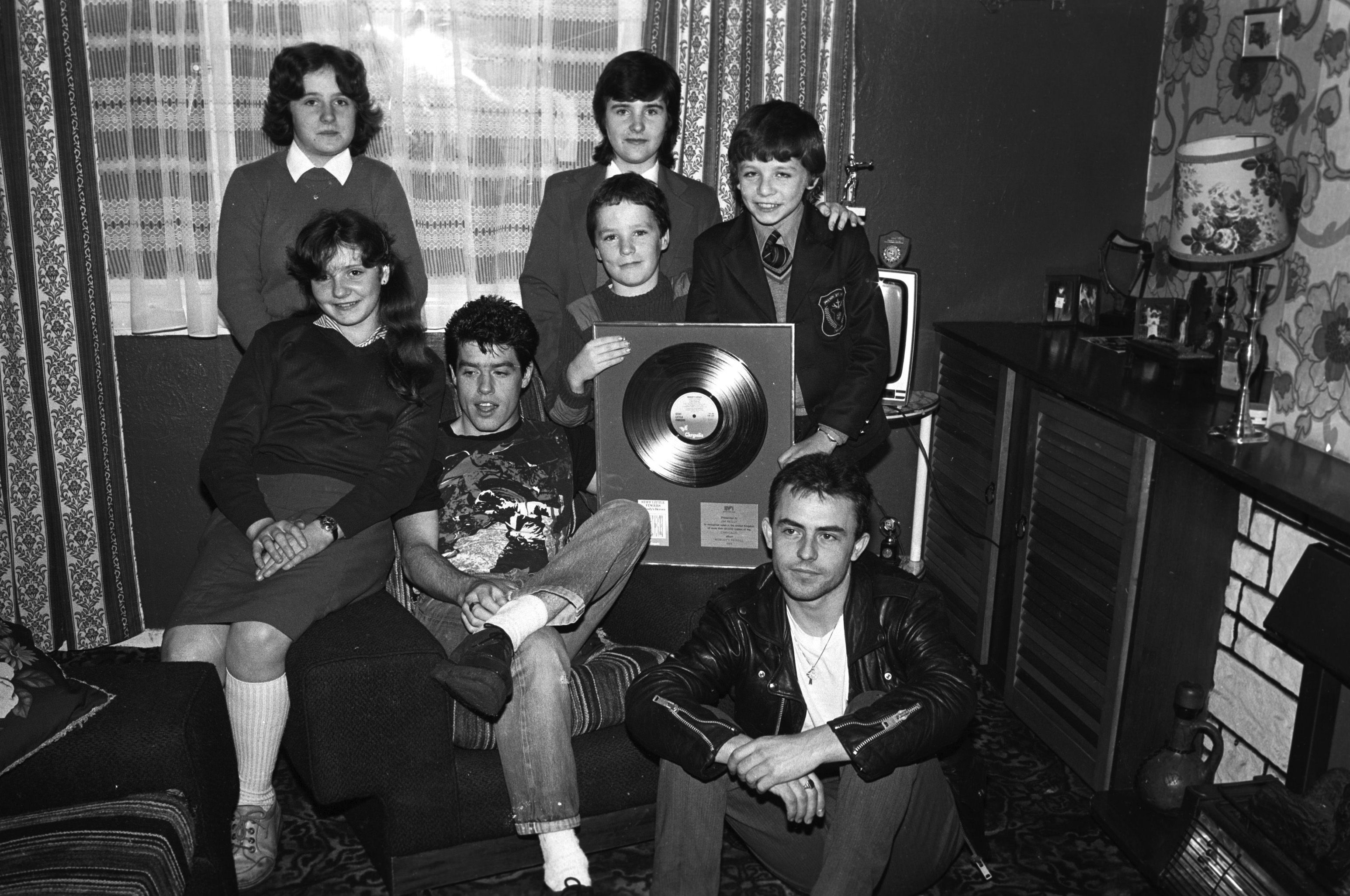IN GOOD COMPANY: Stiff Little Fingers drummer Jim Reilly was snapped by our camerman during a visit home to Turf Lodge in October 1980