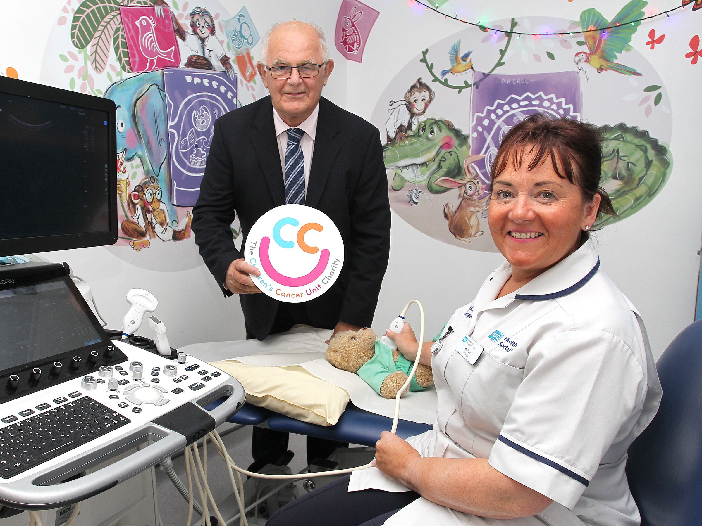 Senior Radiographer Michelle Mooney celebrating the opening of a new ultrasound room at Royal Belfast Hospital for Sick Children with Felix Mooney from the Children’s Cancer Unit Charity.
