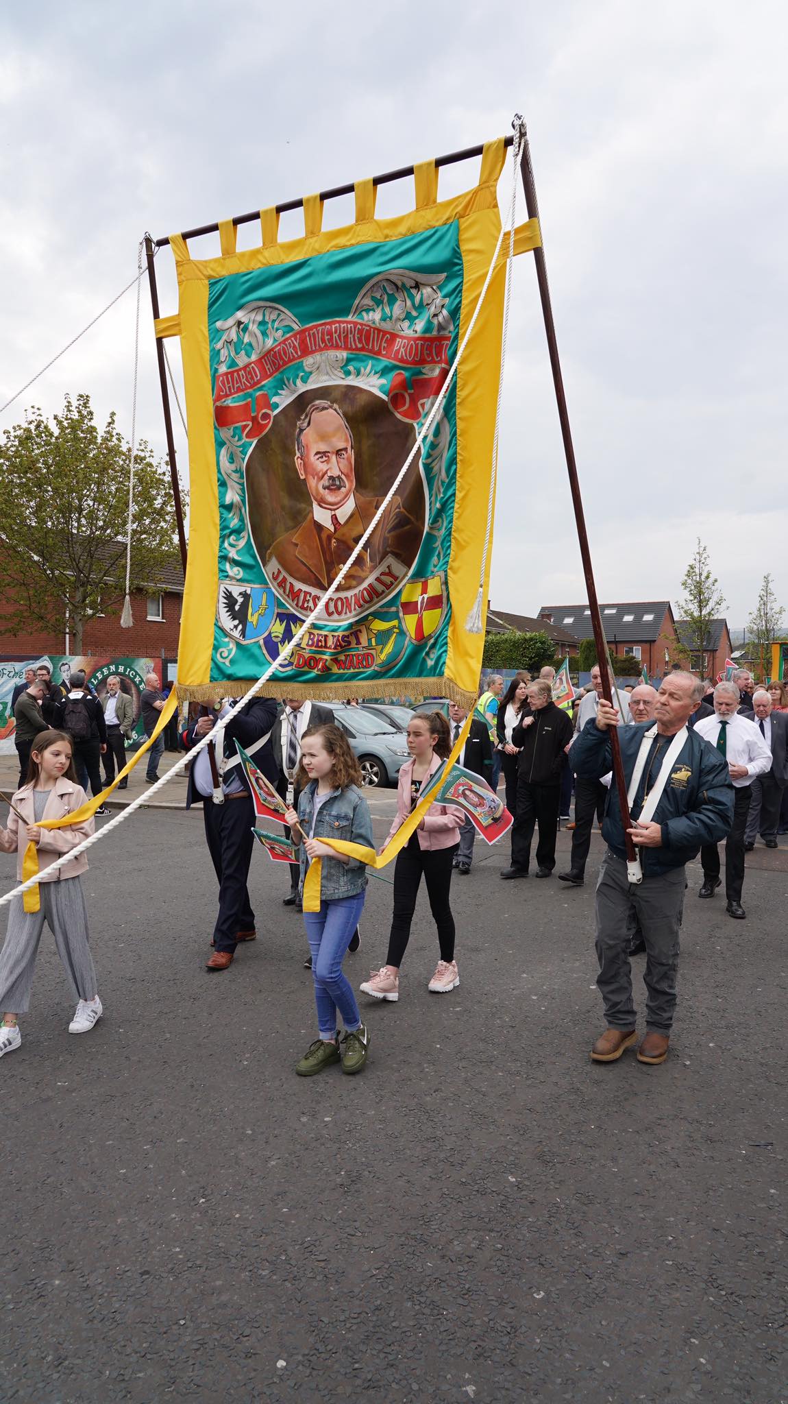 Robbie carrying the SHIP-commissioned James Connolly banner in the parade for the opening of the James Connolly Visitor Centre