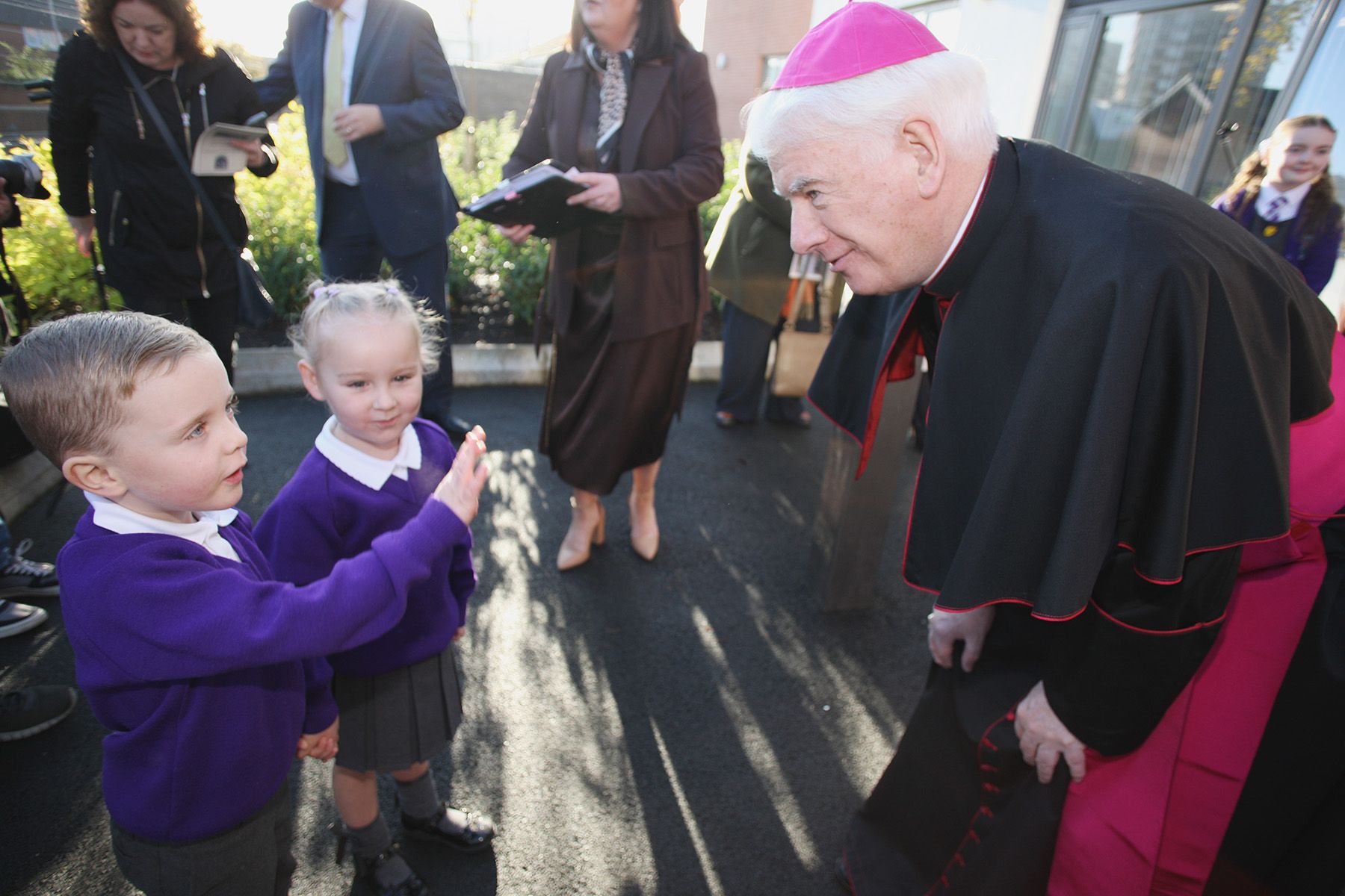 Noel Treanor, Bishop of Down and Connor, meets P1 pupils  P1 pupils Rayah and Odin
