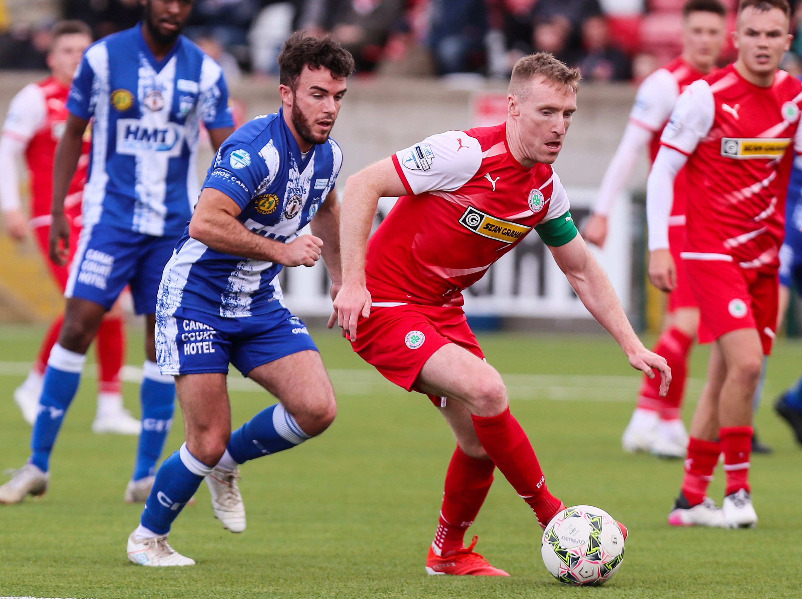 Chris Curran takes the ball away fro Philip Donnelly 