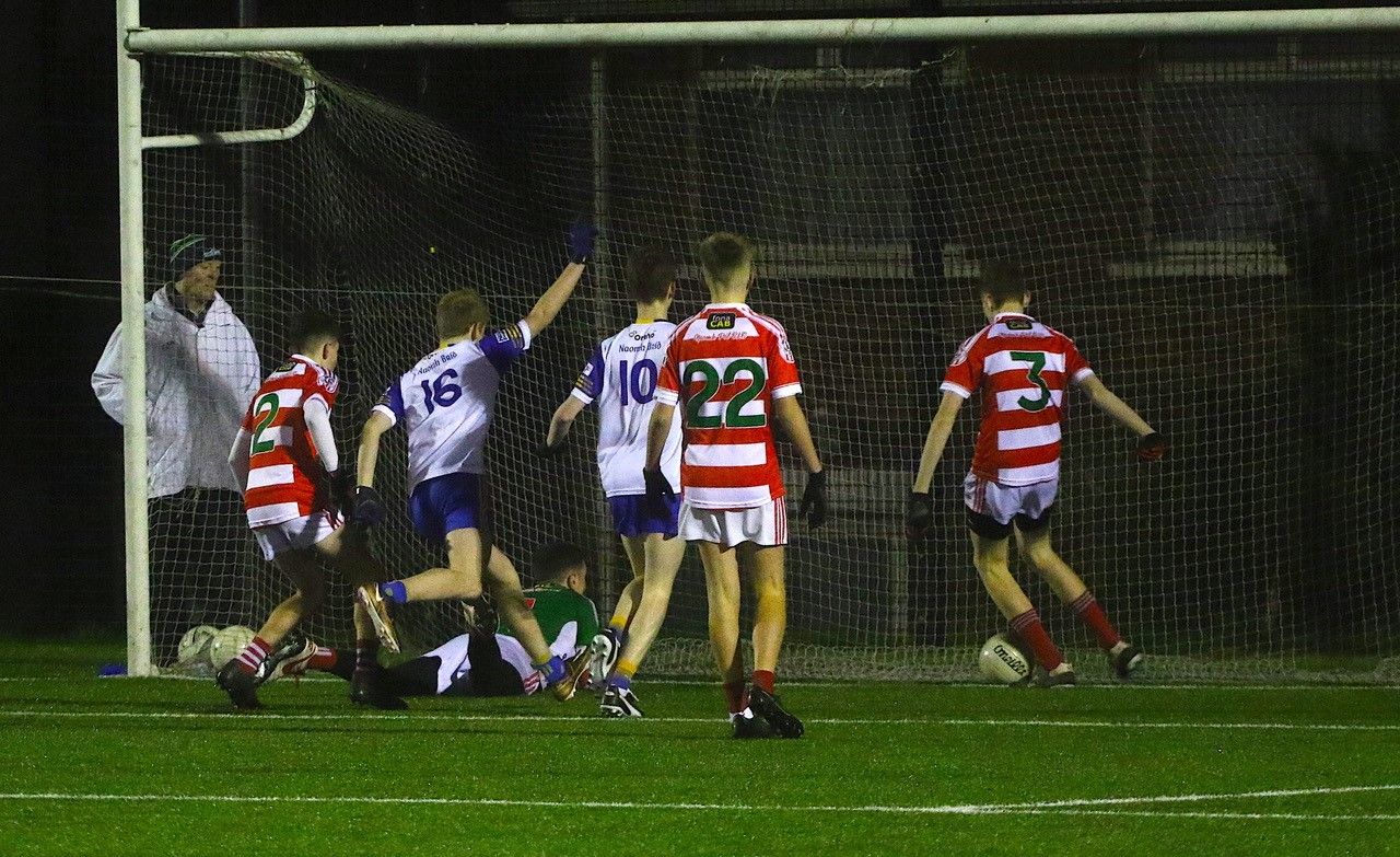 Brendan McMorrow clears Connaill Teggart’s effort off the line 