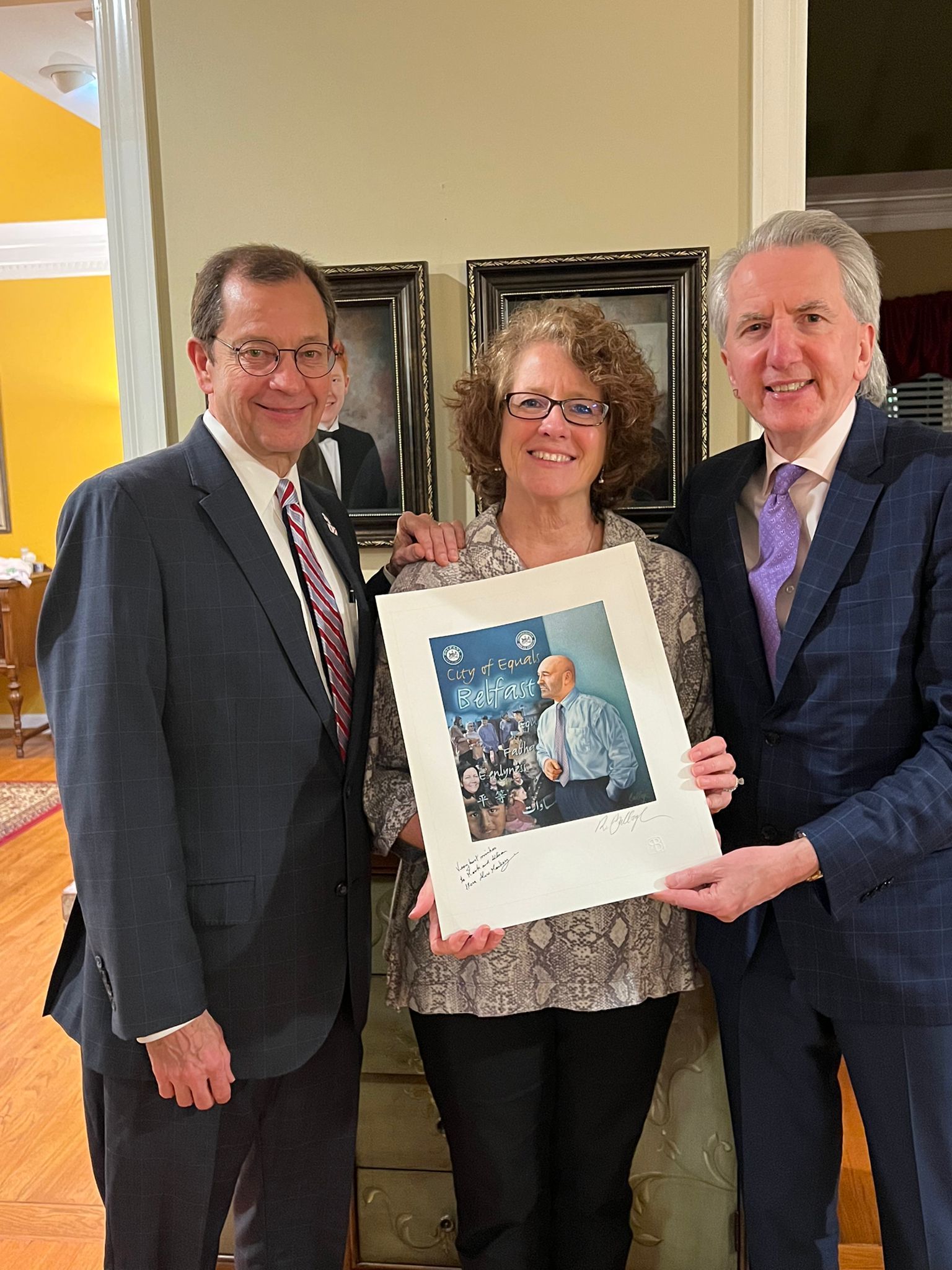 IN THE FRAME: Mark and Allison Jackson accept a Robert Ballagh print of former mayor Alex Maskey