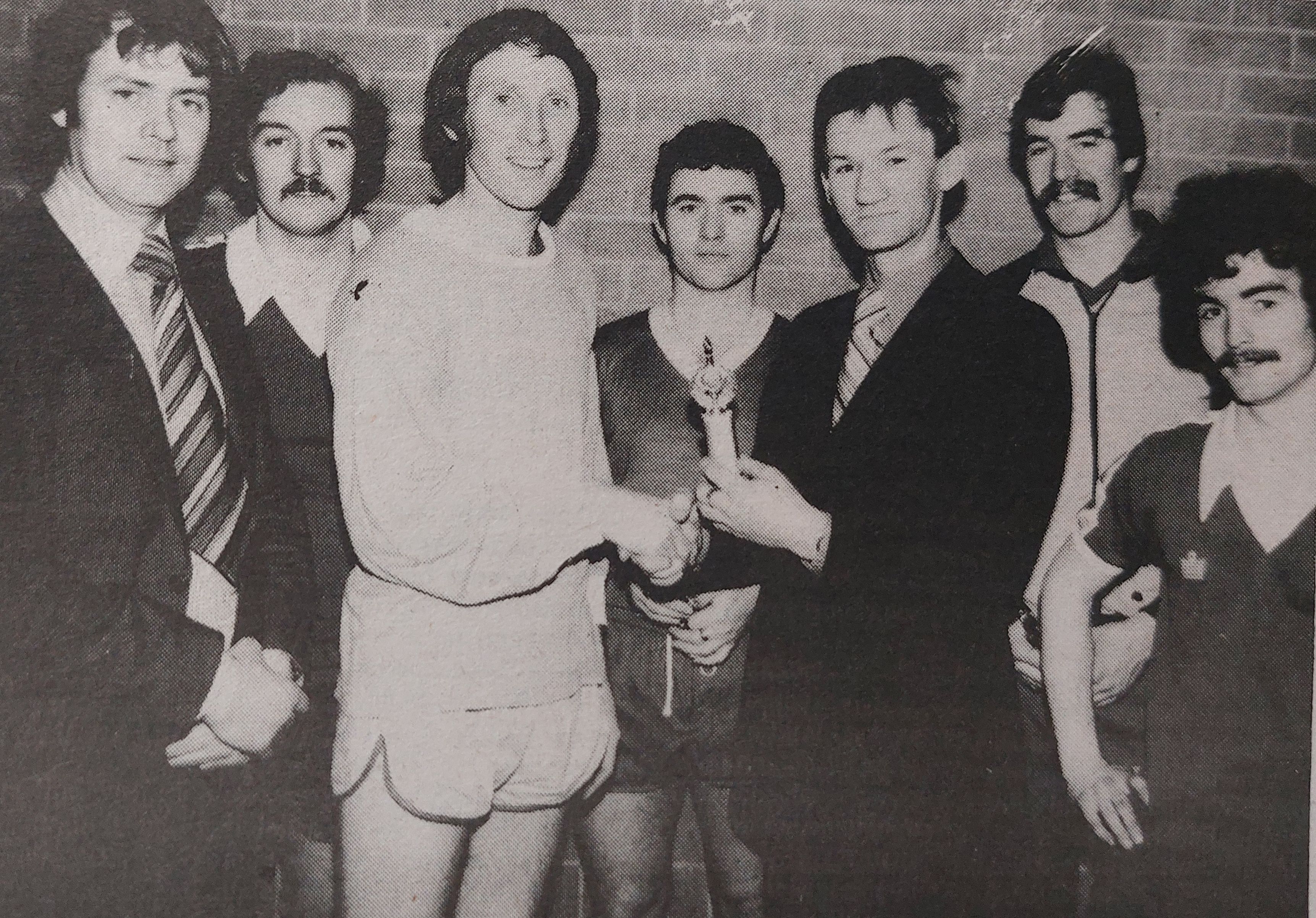 Danny Fulton, captain of the La Salle teachers five-a-side team, accepts the award for winning the Beechmount Leisure Centre lunch-time league from Cllr Liam Hunter. Also present is Leisure Centre manager John McGinley and the rest of the La Salle players