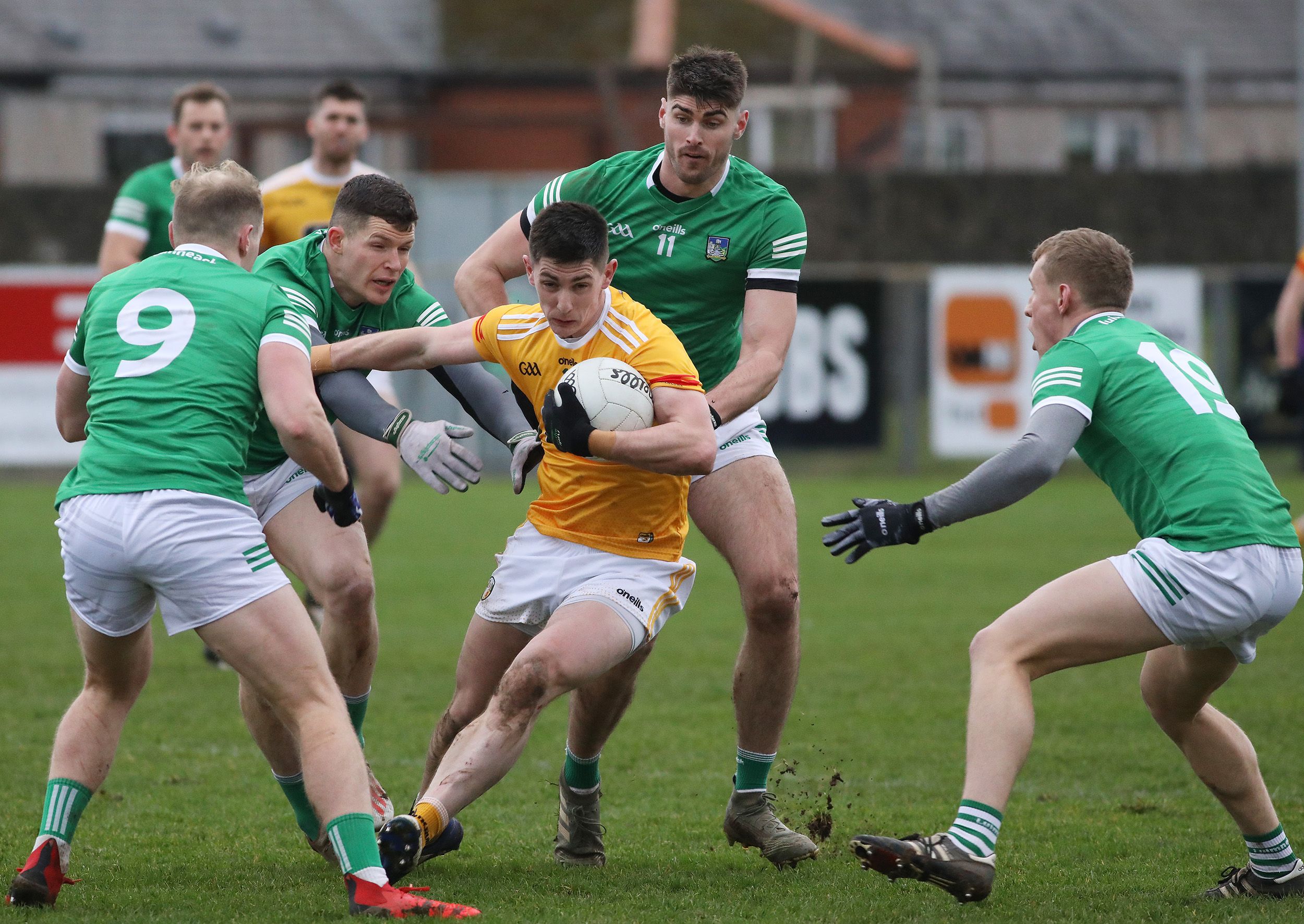 Paddy McAleer is surrounded by green jerseys 