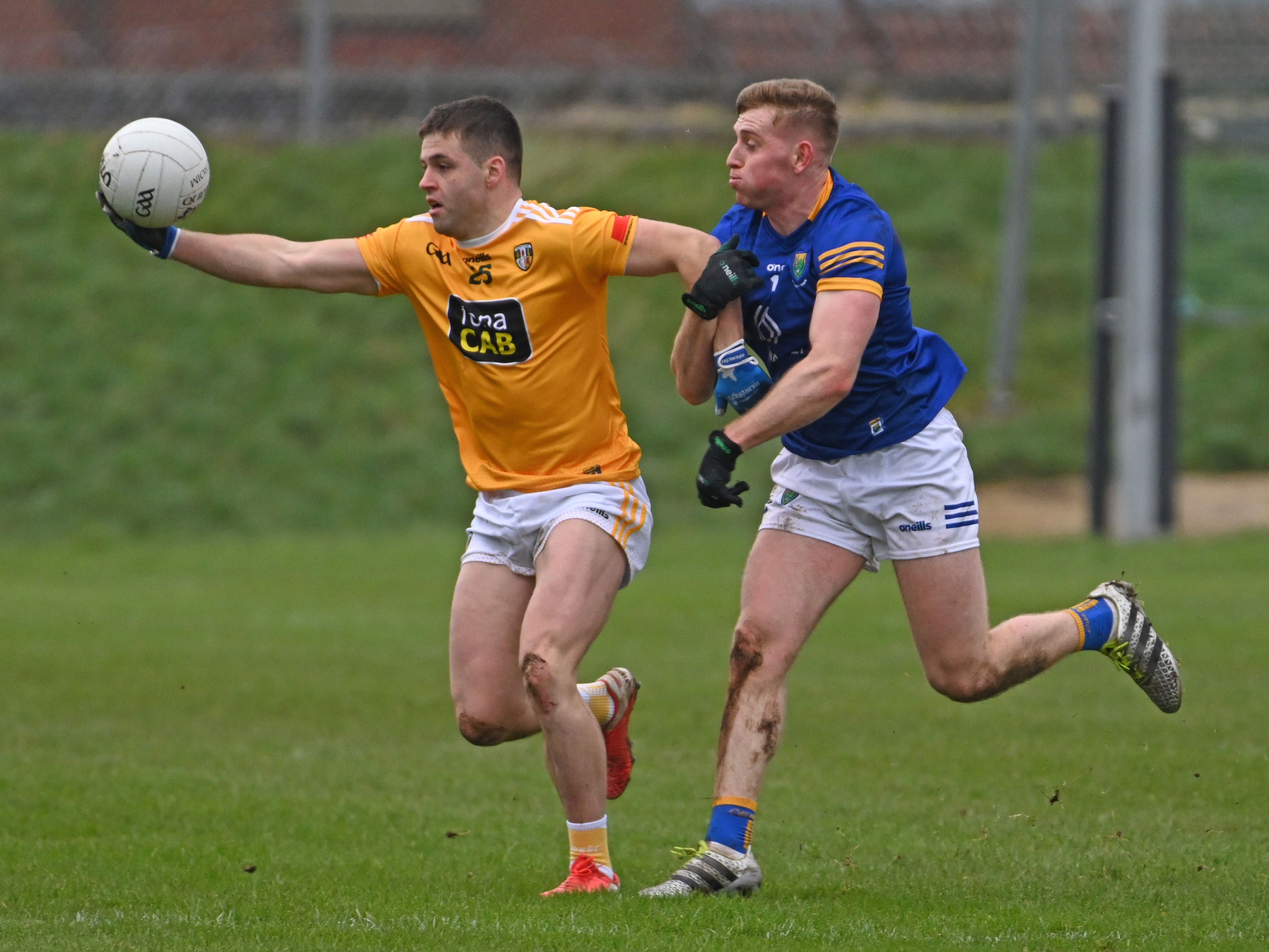 Patrick McBride gets his hand to the ball ahead of Daragh Fitzgerald