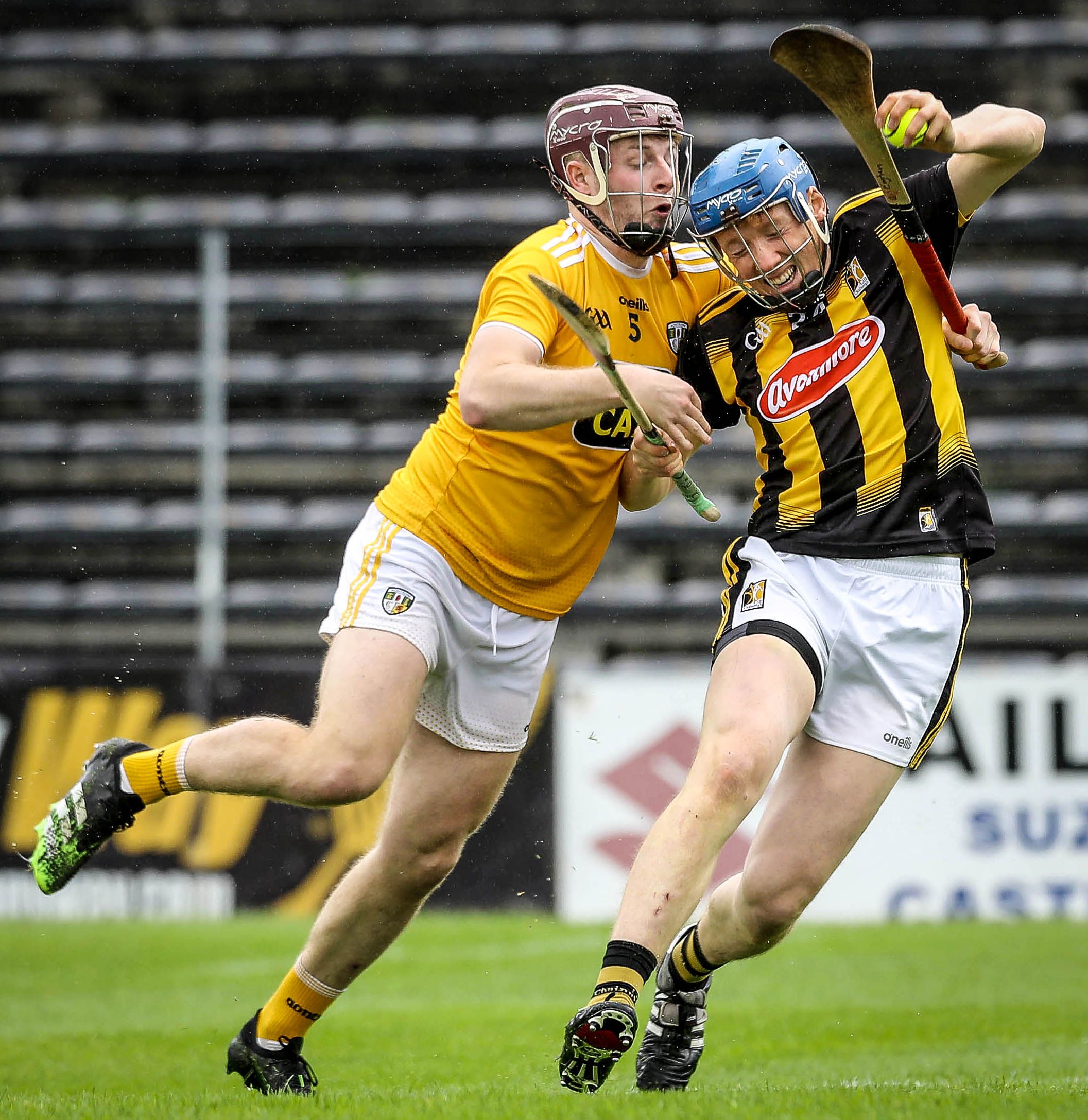 Eoghan Campbell challenges John Donnelly in last year's meeting between the teams