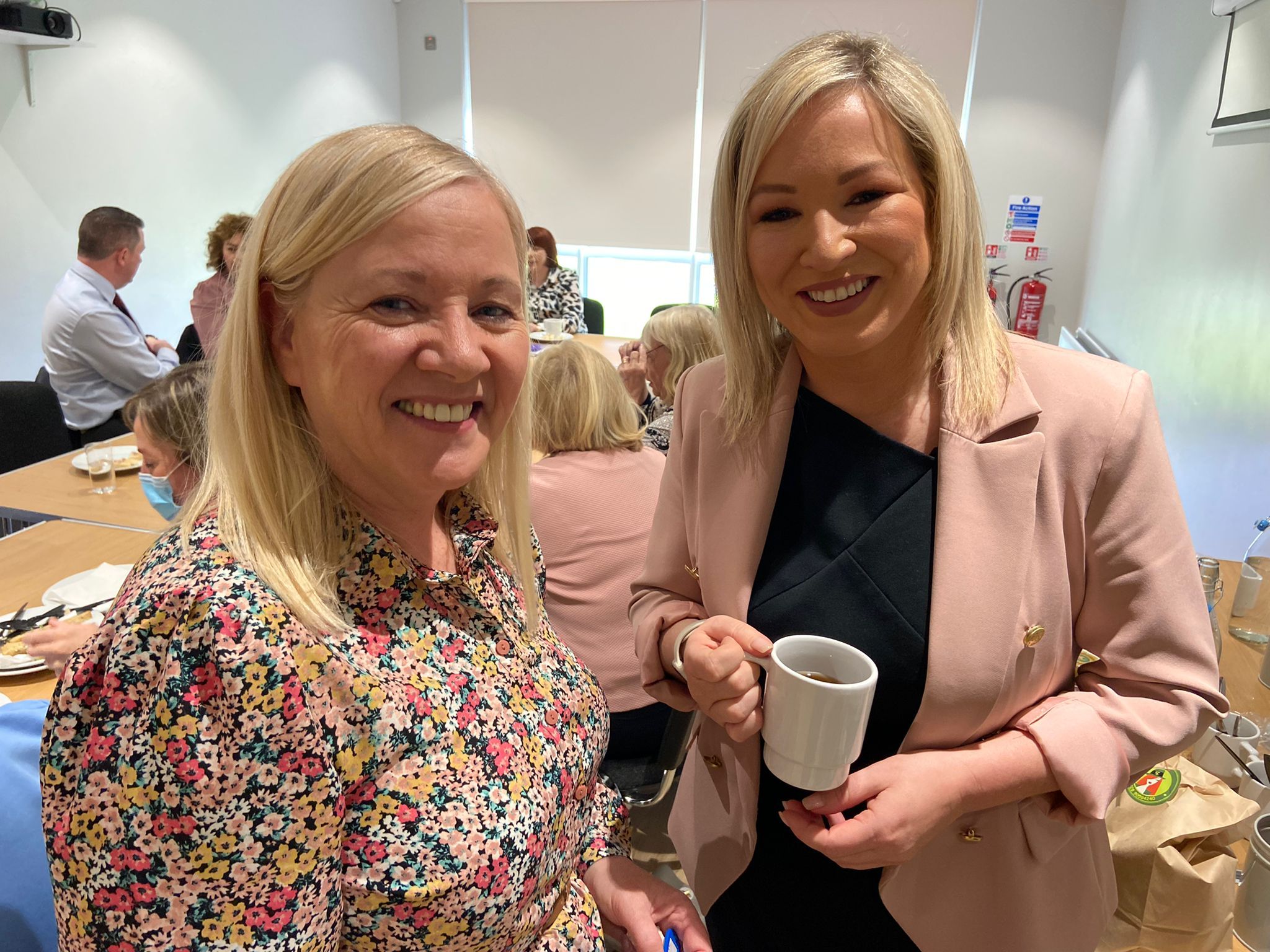 Sally Fogarty from the Grace Family Centre speaking to Michelle O'Neill