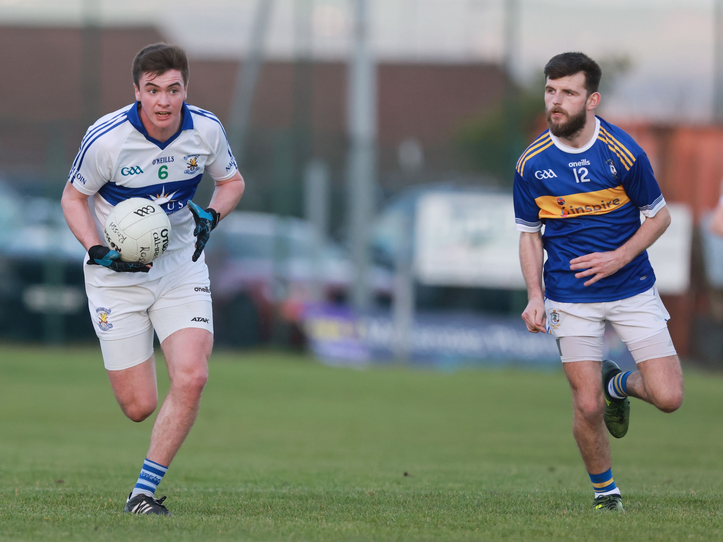 Oisin Donnelly is tracked by Matthew Mallon