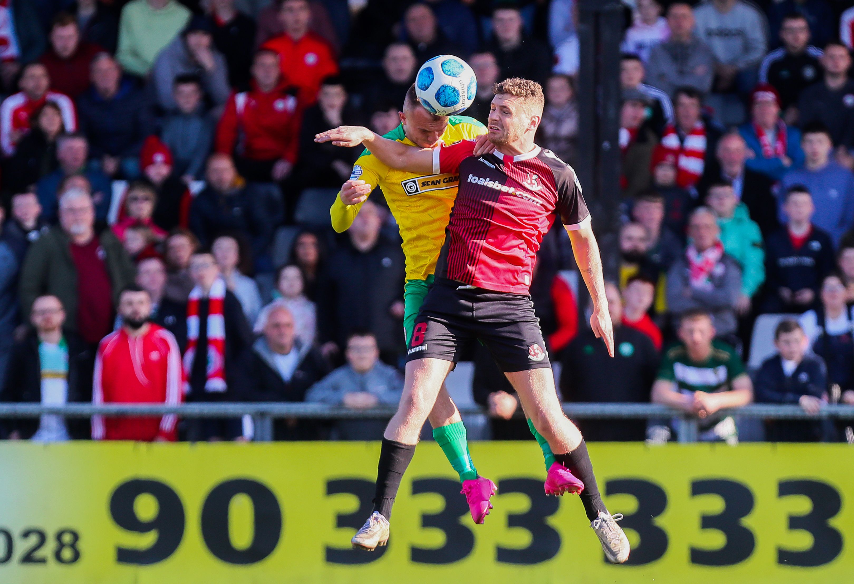 Ben Kennedy and Rory Hale tussle for the ball