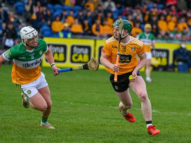 Conal Cunning is tracked by Offaly's Joey Keenaghan