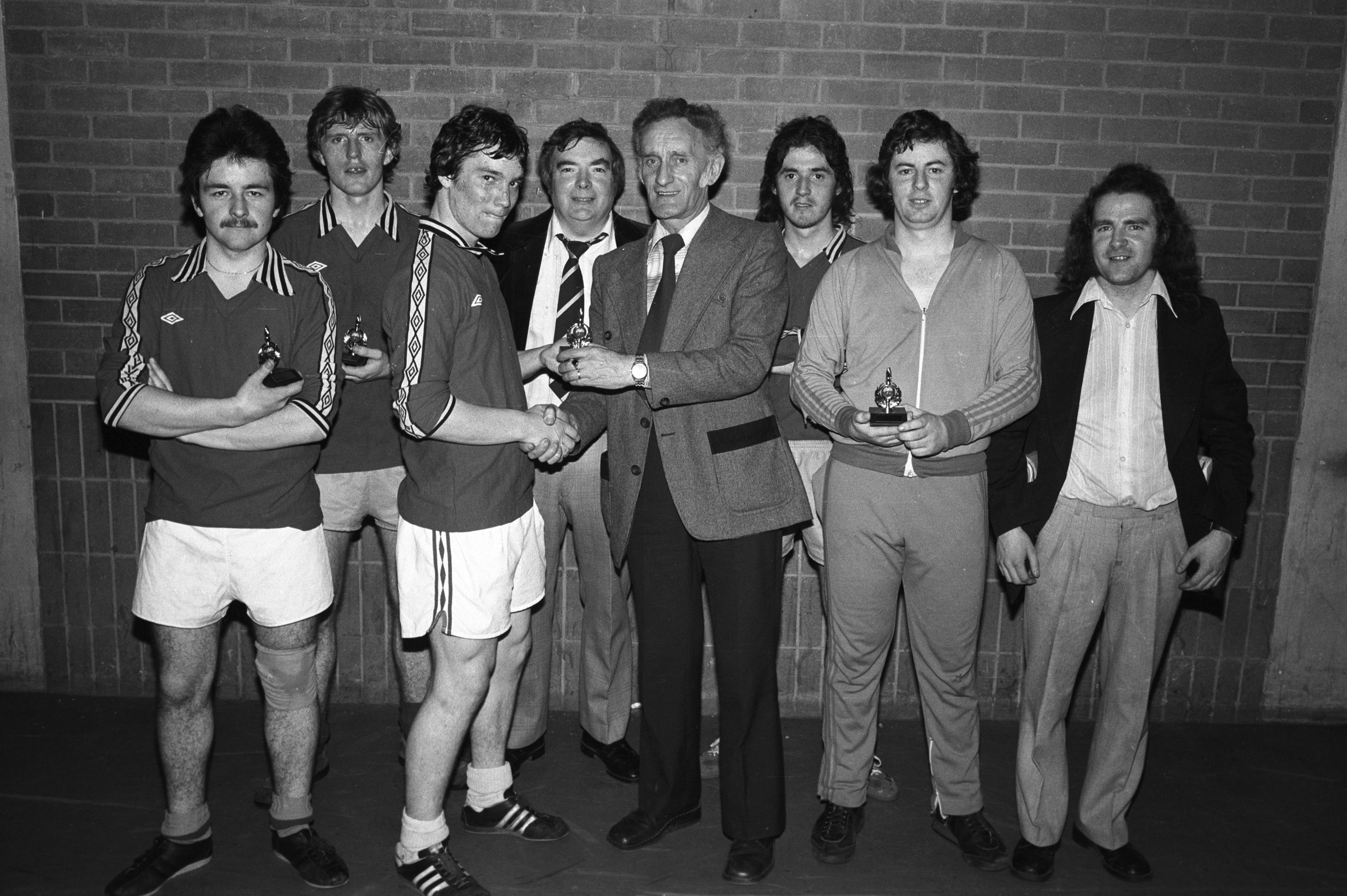 George McNeill makes a presentation to runners-up Willowbank at Beechmount Annual 5-a-side Football Tournament