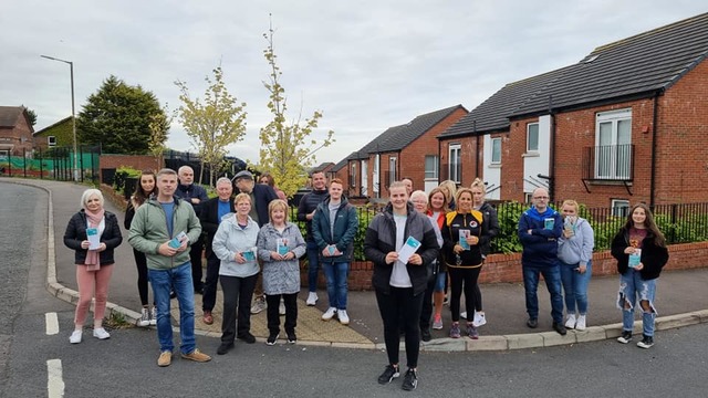 Aisling Reilly (centre foreground) with party colleagues in the Upper Springfield