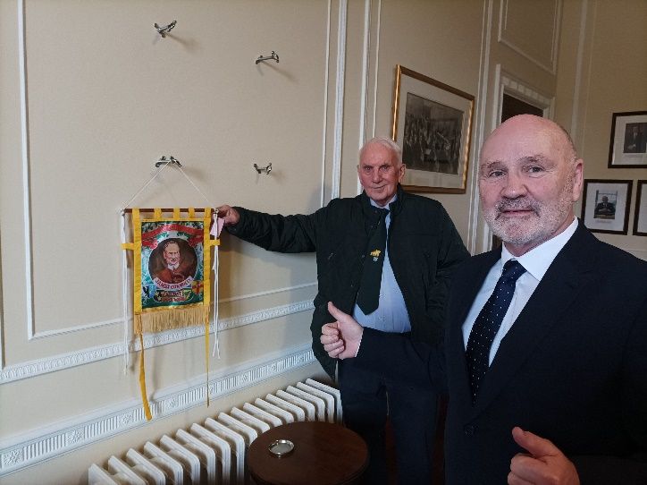 Two former dockers, Liam with Alex Maskey.