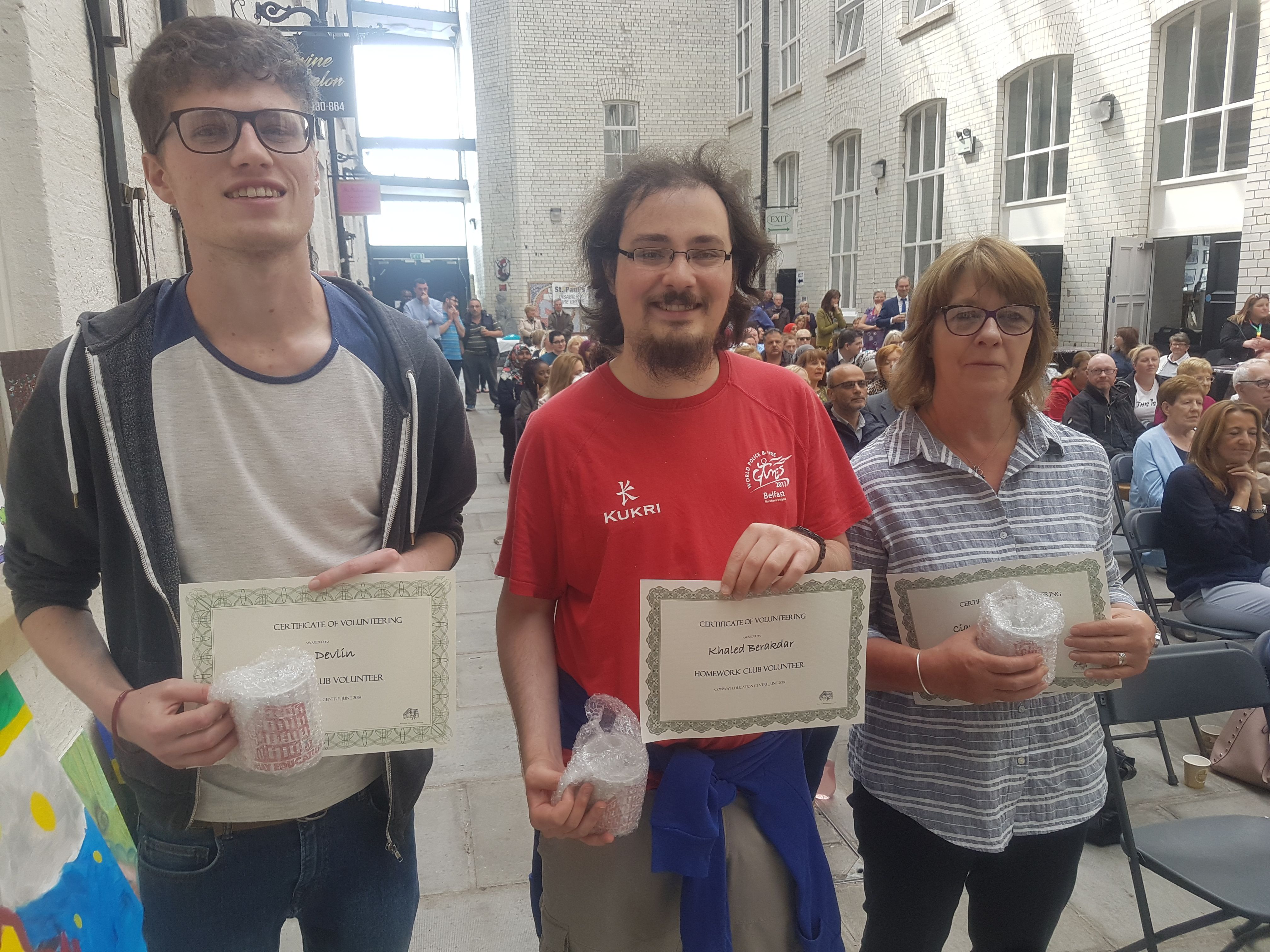 Conway volunteer mentors with their certificates