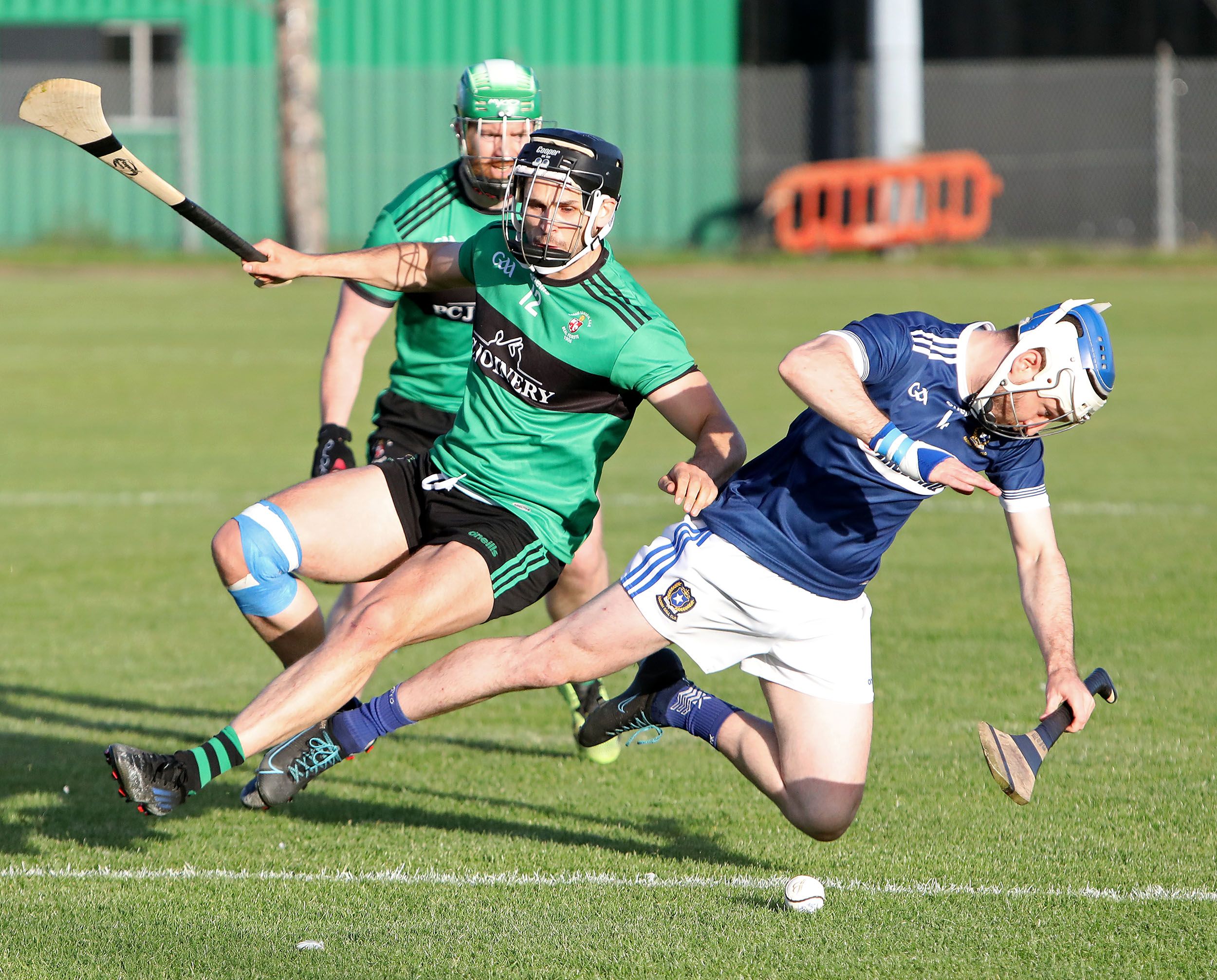 Mark Napier takes a tumble under the challenge of Mark Rea of Sarsfield's at the Bear Pit on Friday 