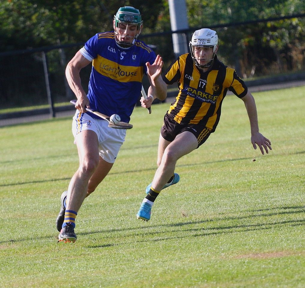 Gerard Walsh gets away from Tiernan Smyth