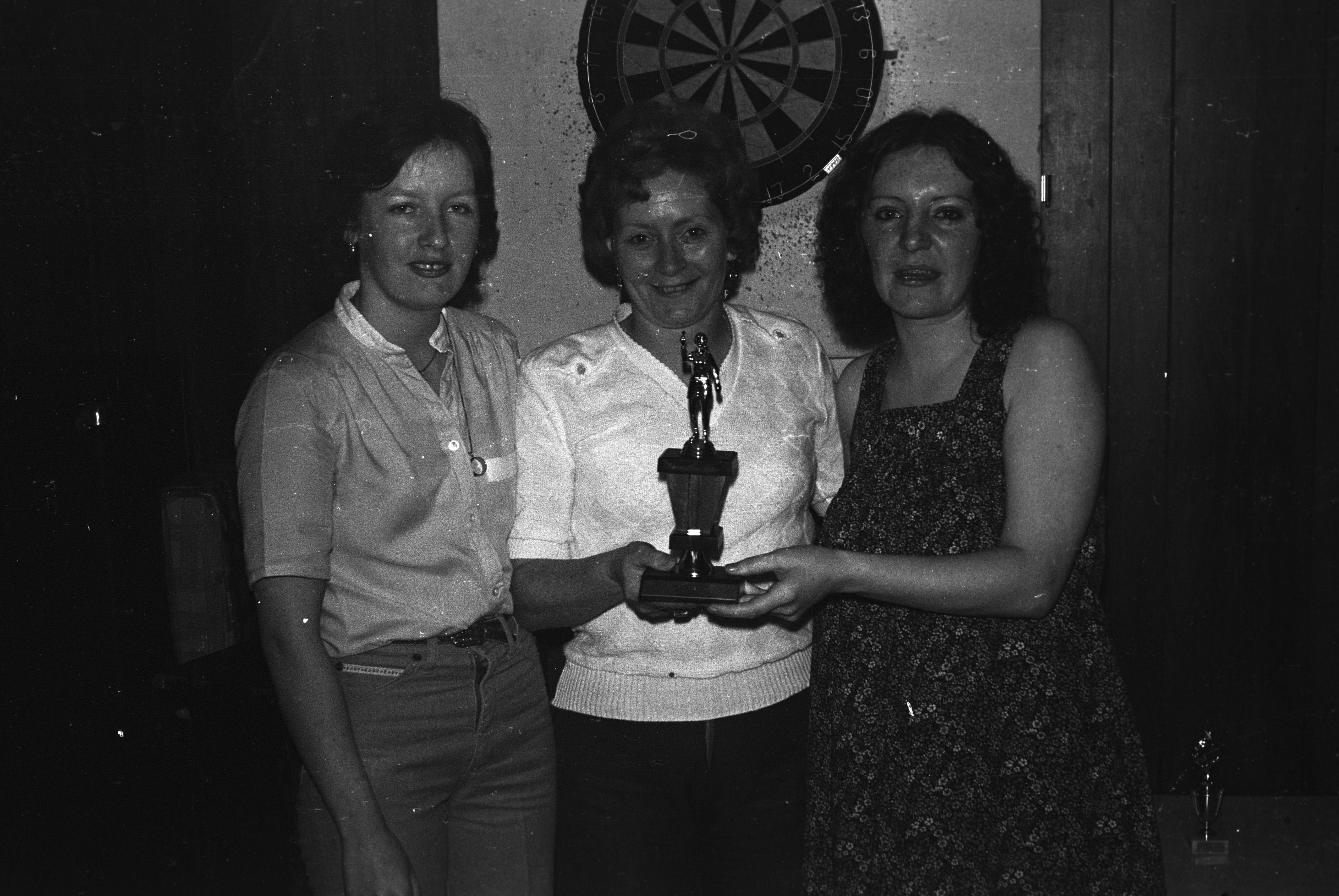 B McCourt (runner-up), Rosemary Donnelly and Maureen Montgomery at the Ardoyne Martyr's Memorial Dart Tournament