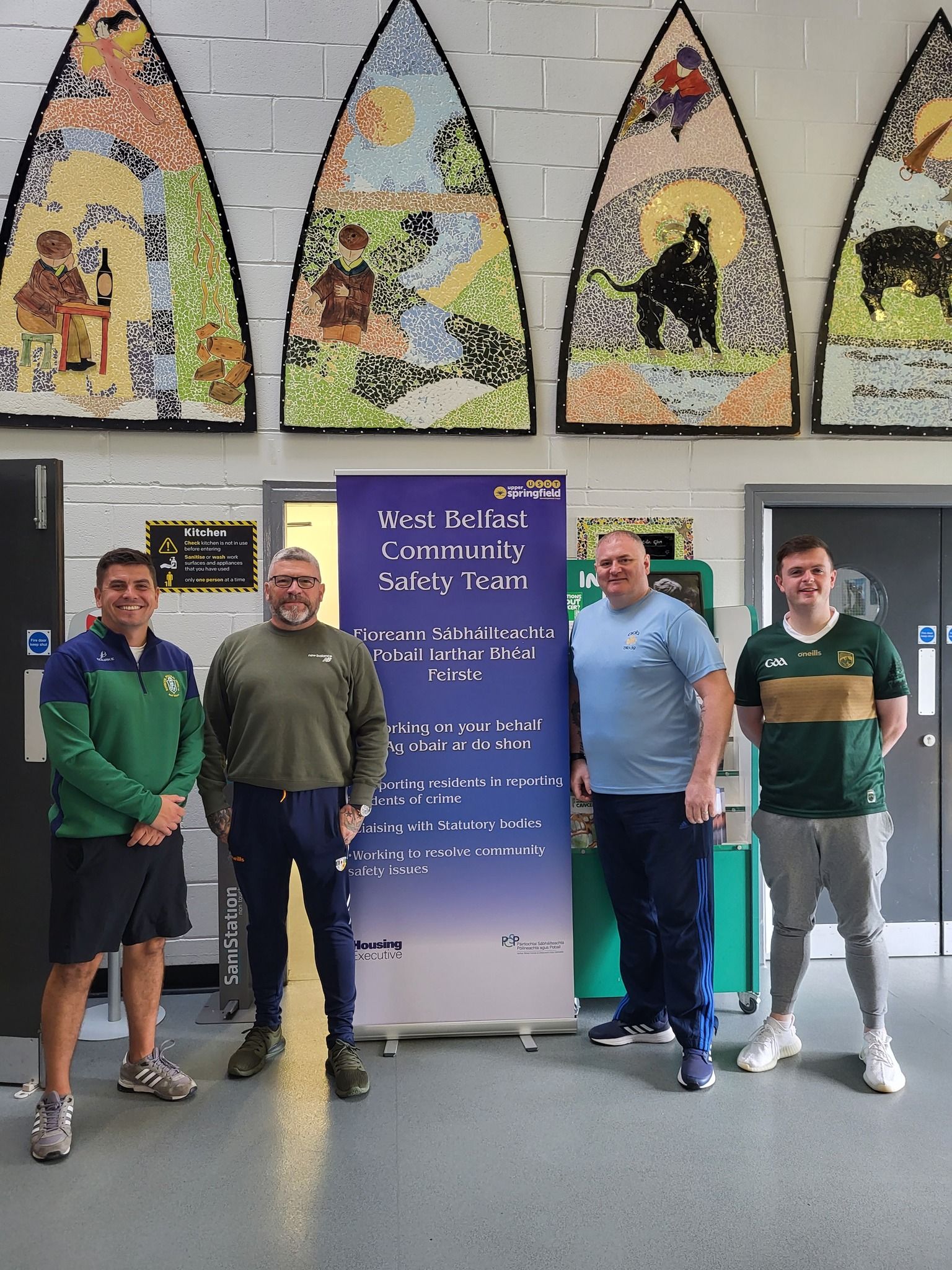 Danny Baker MLA, Cllr Caoimhín McCann and the Colin Community Safety team