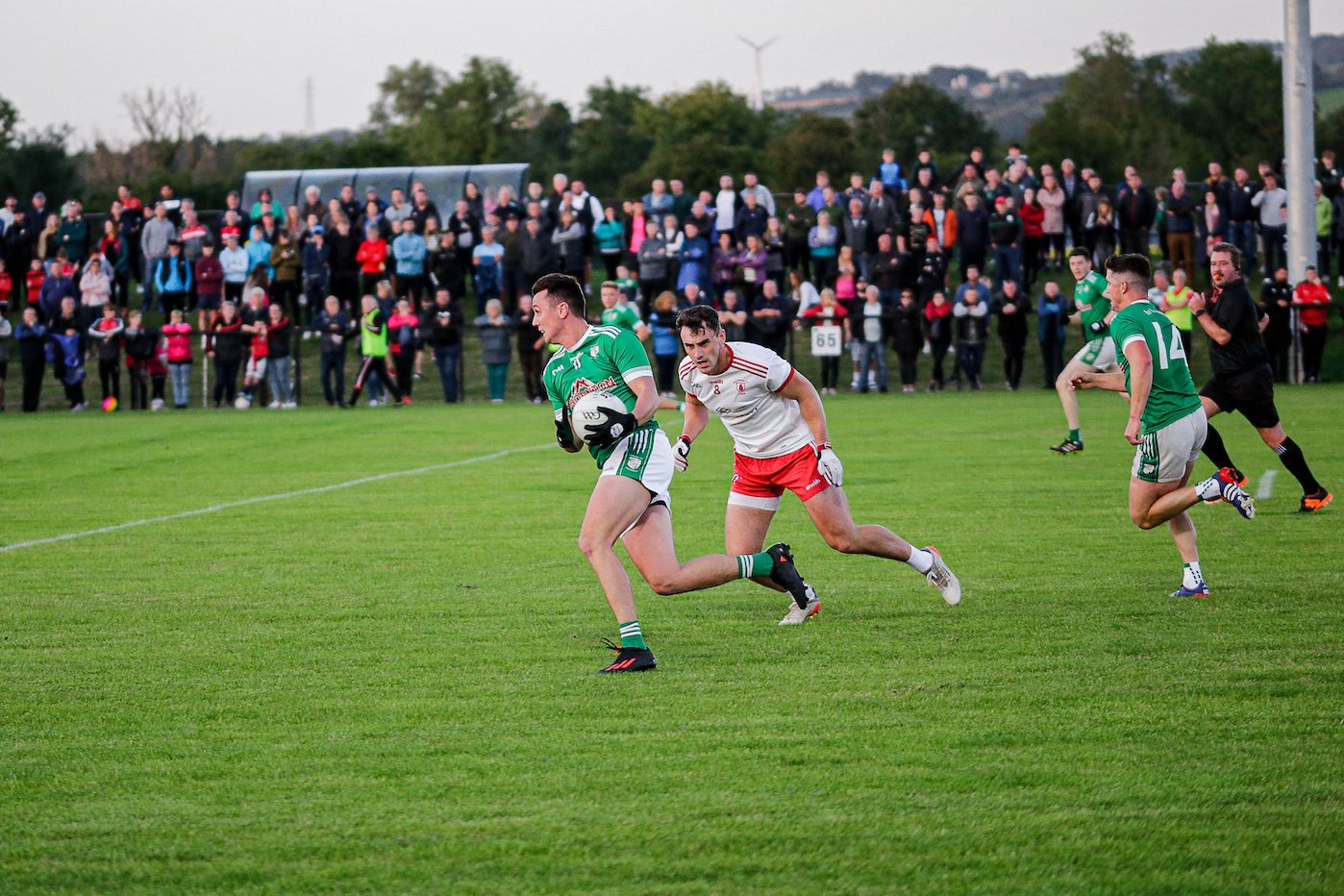 Paul McCann gets away from Padraig Mervyn