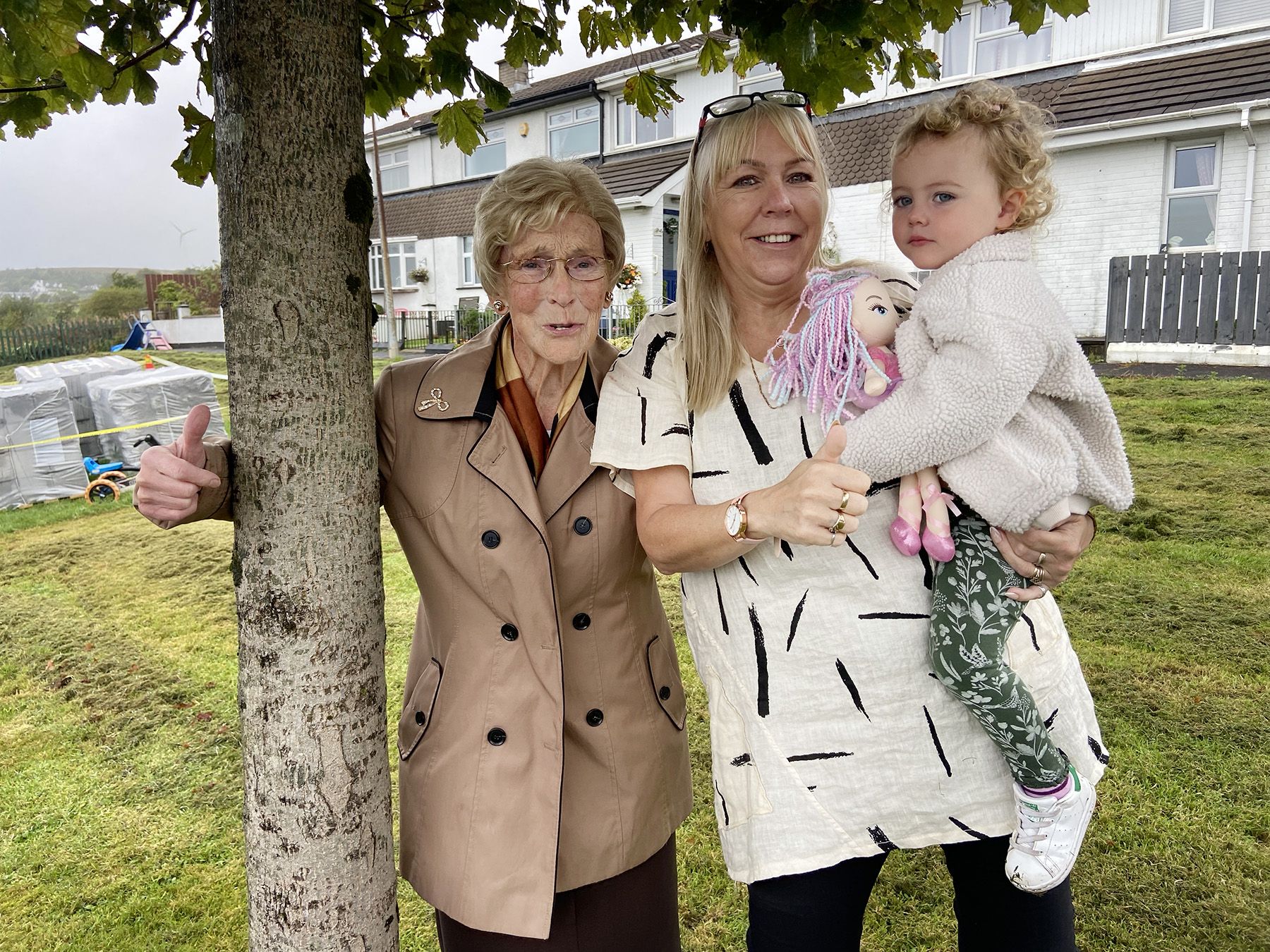 COMMUNITY: Resident Kate Prior, with daughter Maura Tubridy and great grand-daughter Álainn Tubridy with the tree they saved
