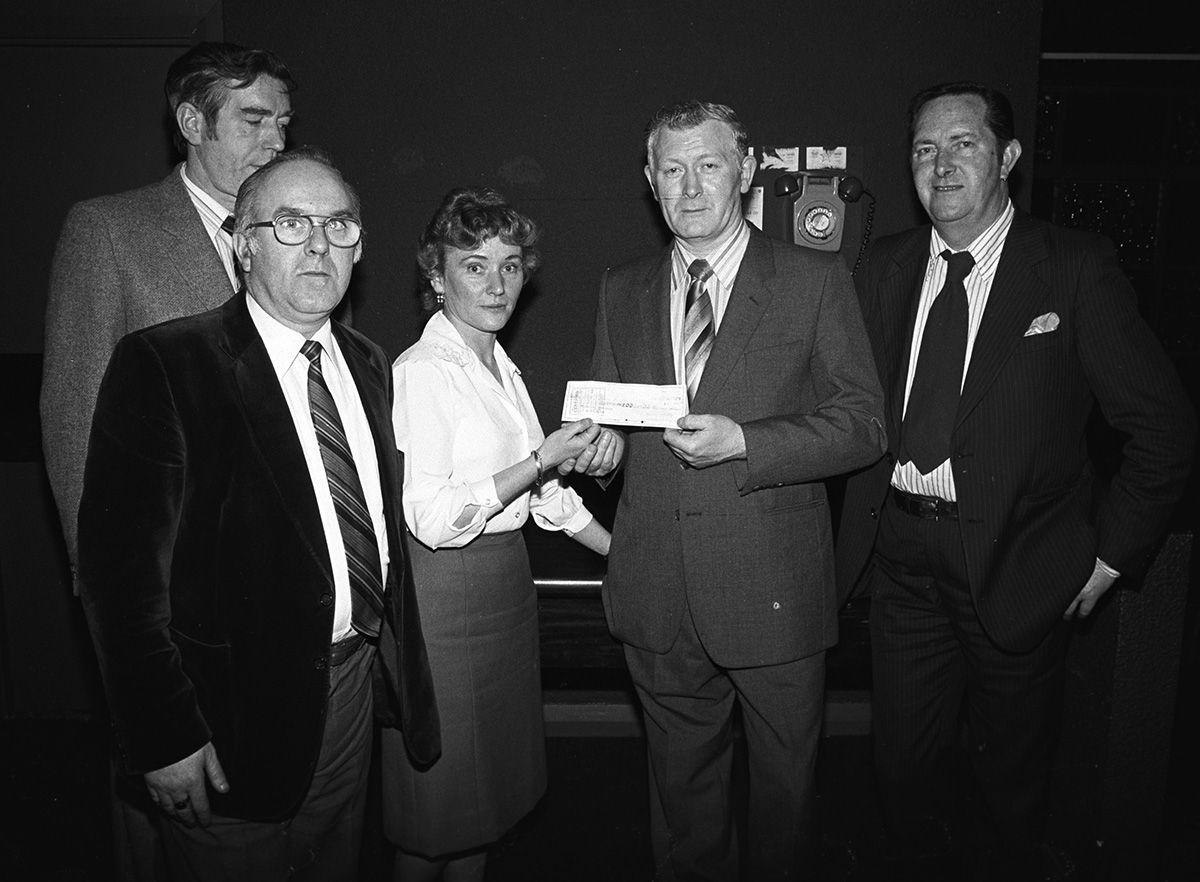 Liam Higgins, Roddy McCorley Social Club chairman, and committee members John Sands, Sean ‘Red’ and Michael McMorrow, present a cheque to Green Cross secretary Gonne Roe from Daniel O'Connell AOH of America, New Jersey