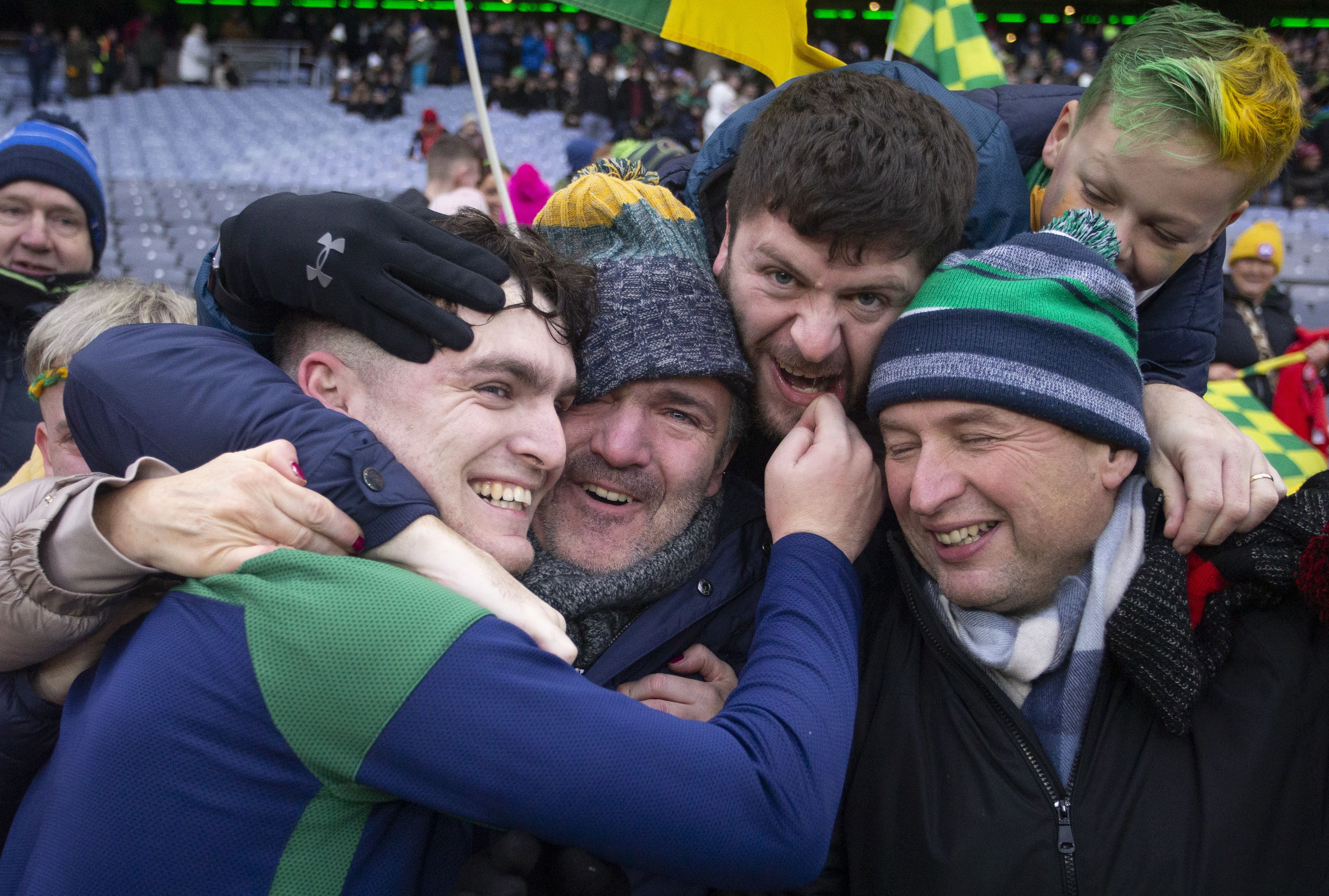Ryan Elliott celebrates with his father, Shane, after Dunloy's All-Ireland semi-final win