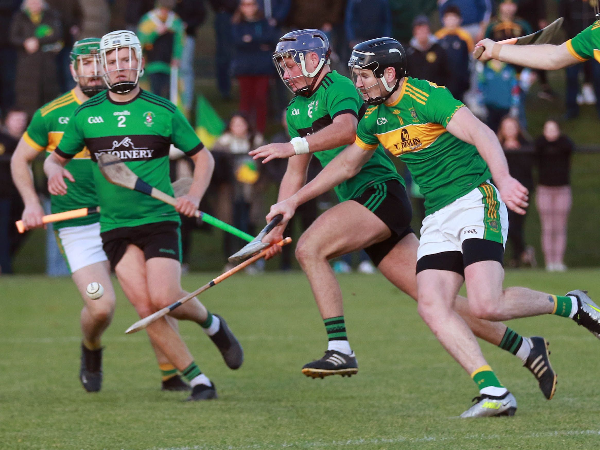 Caolan McKernan breaks out of defence for Sarsfield's 