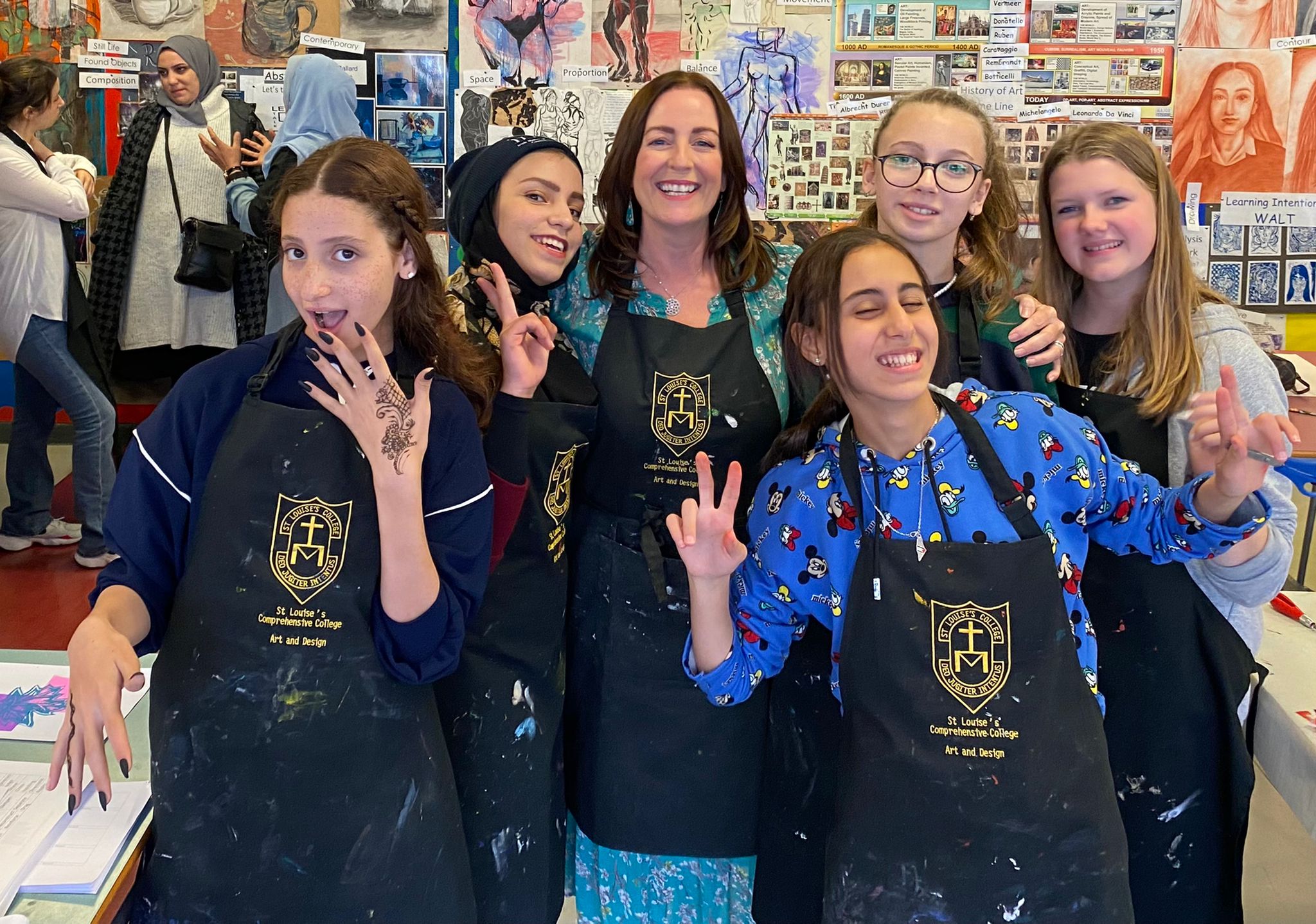 Mairead, with Yara, Rahaf and Malak at St Louise's Comprehensive College in an art class