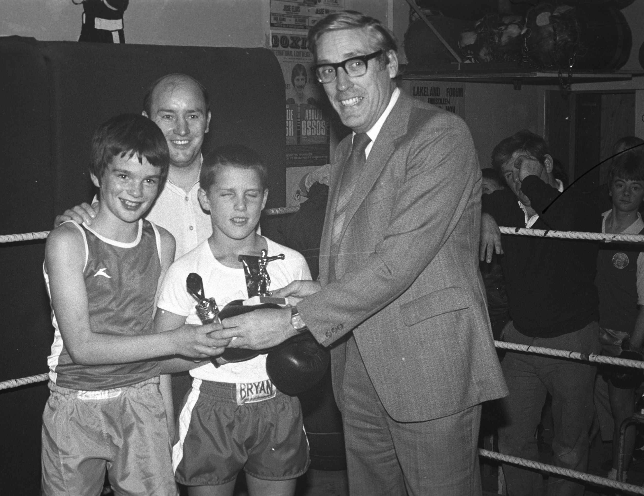 Paddy Morgan (Frank Allen Amusements) presents prizes at St Agnes' ABC to Terry Enright (St Agnes’) and Billy McComb (Corpus Christi)