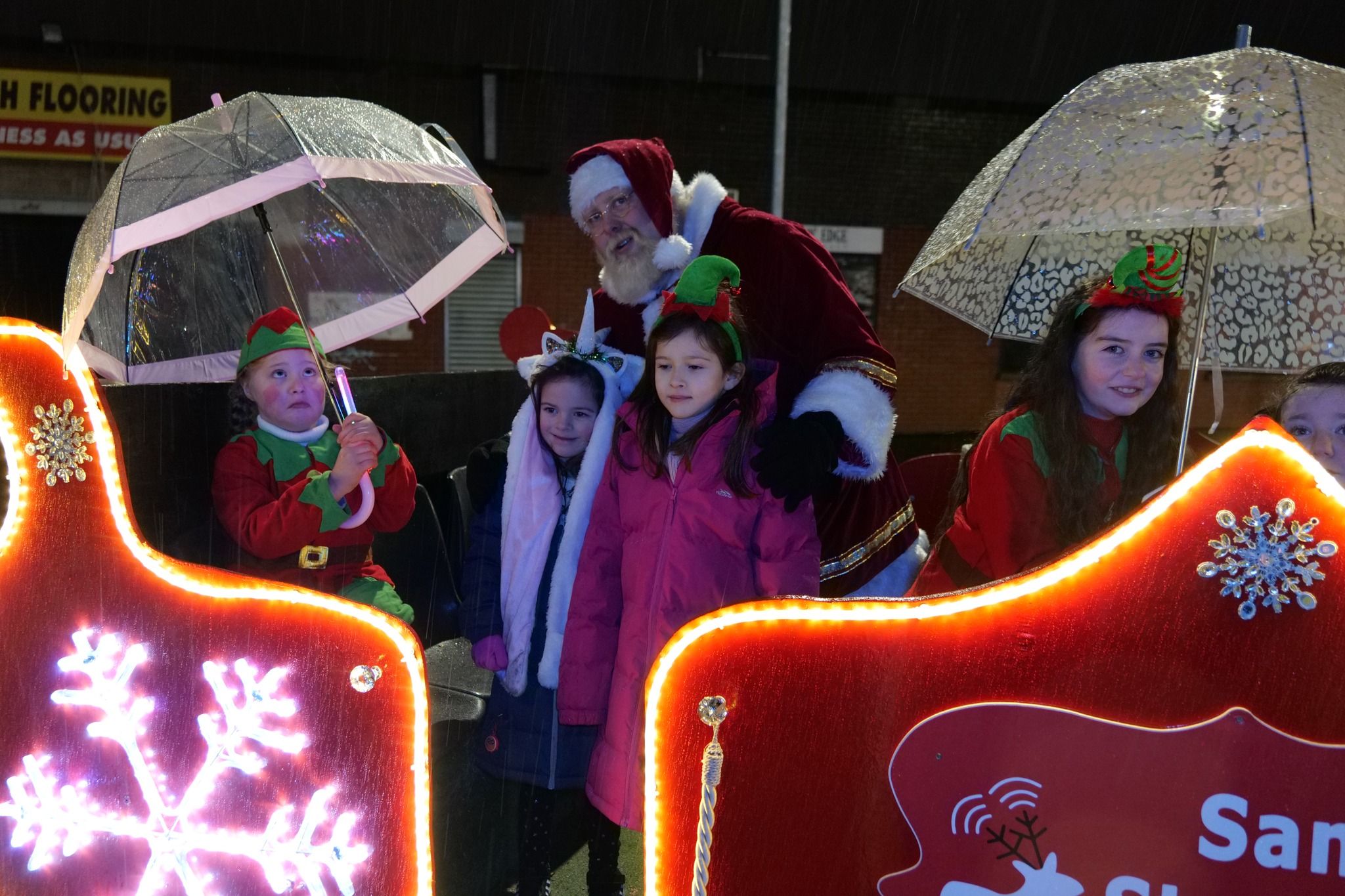 SANTA: Santa, his helpers and local children at last year's parade SANTA: Santa, his helpers and local children at last year's parade