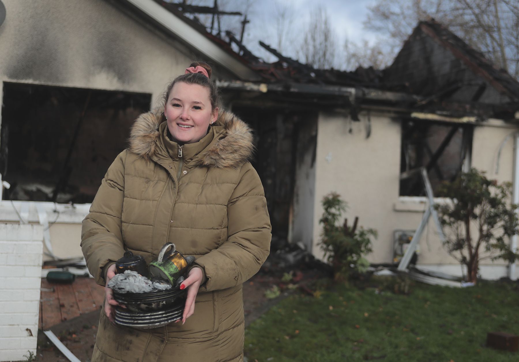FIRE: Johnny's daughter Charlene with the few items left that weren't destroyed by the fire