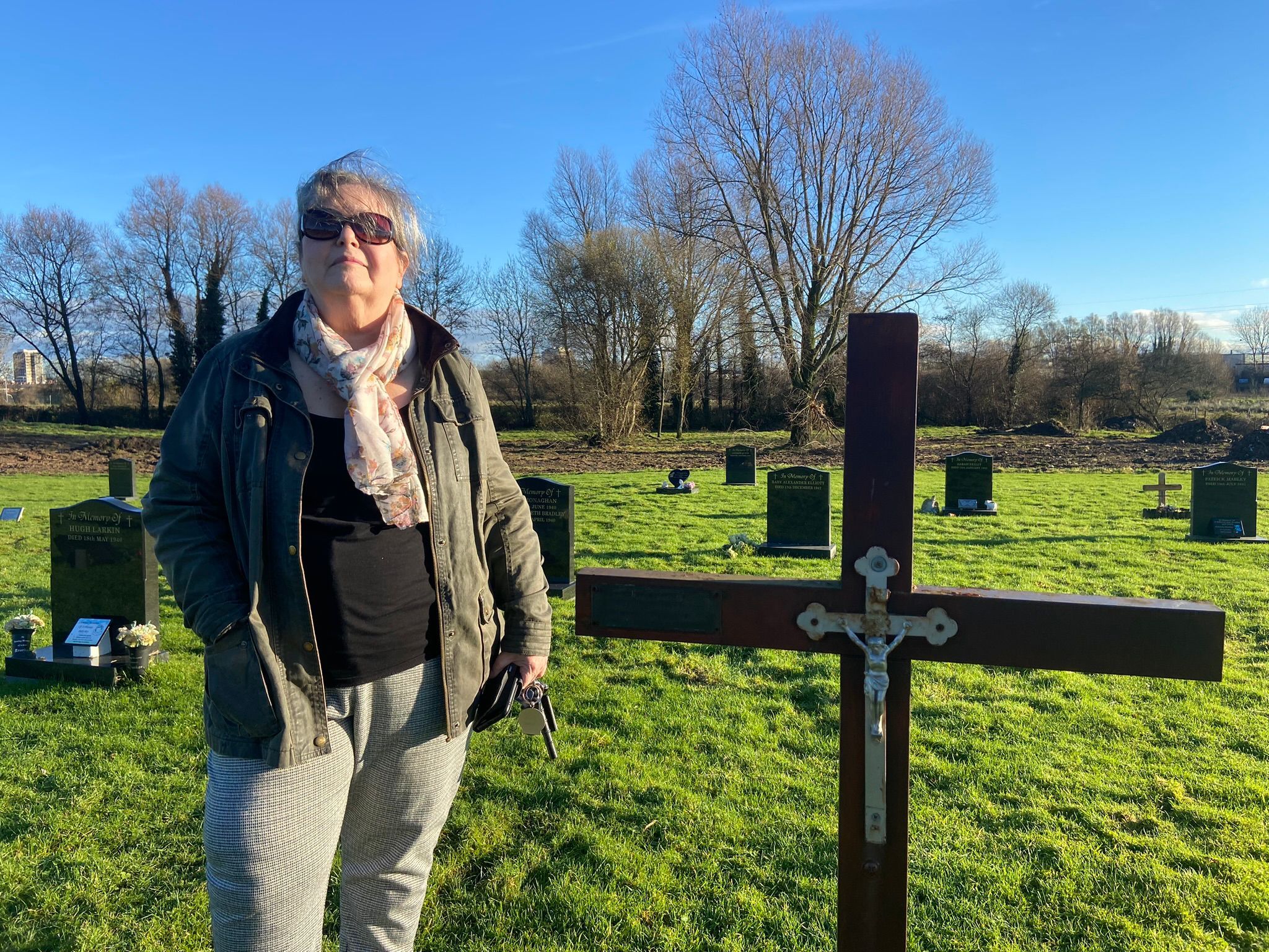 CONCERNS: Toni Maguire at Milltown Cemetery with the ongoing work in the background CONCERNS: Toni Maguire at Milltown Cemetery with the ongoing work in the background