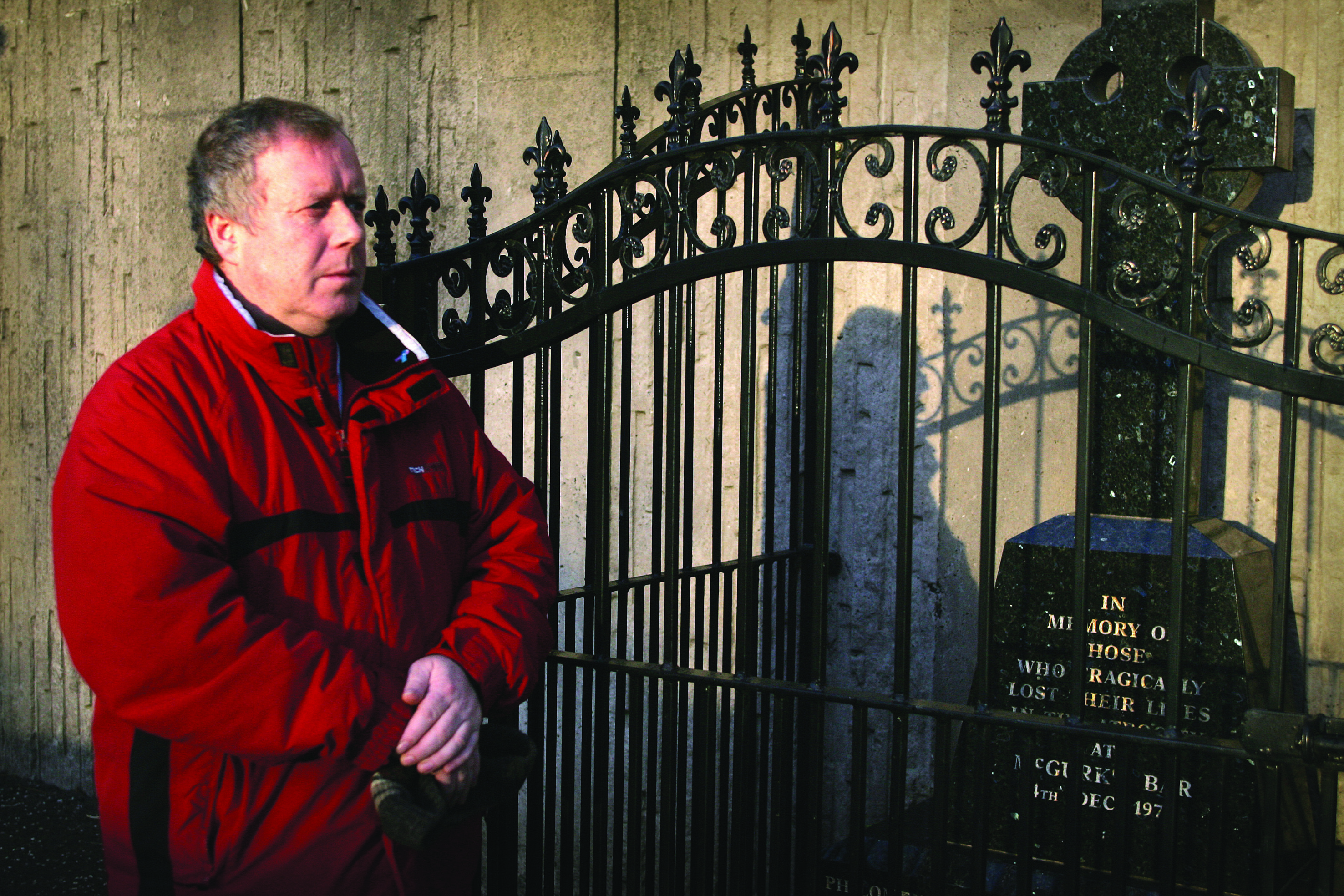 MCGURK'S BAR: Robert outside the memorial plaque to the victims of the bombing which was erected on the site Robert previously outside the memorial plaque to the victims of the bombing which was erected on the site