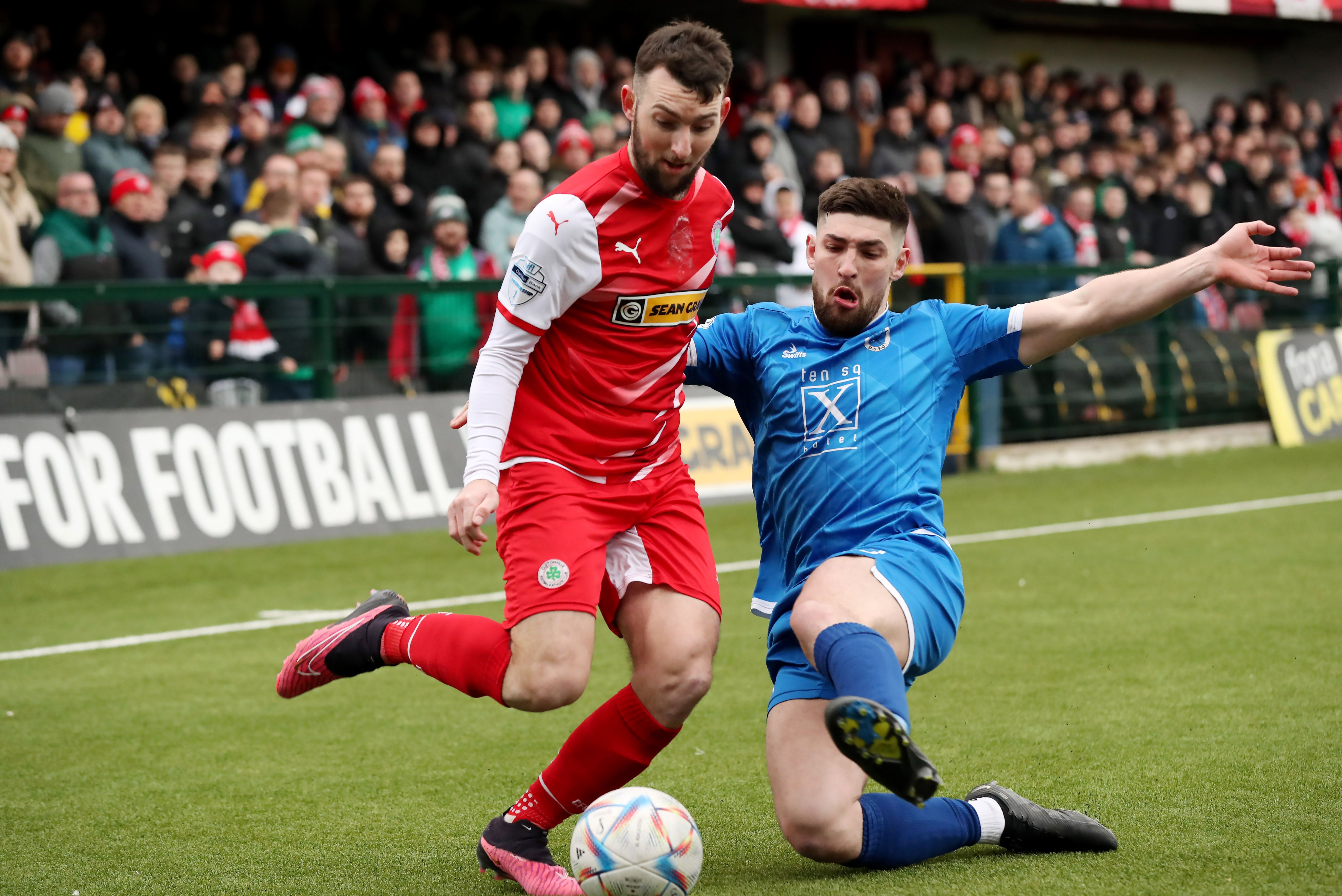  Jamie McDonagh is challenged by Michael Ruddy