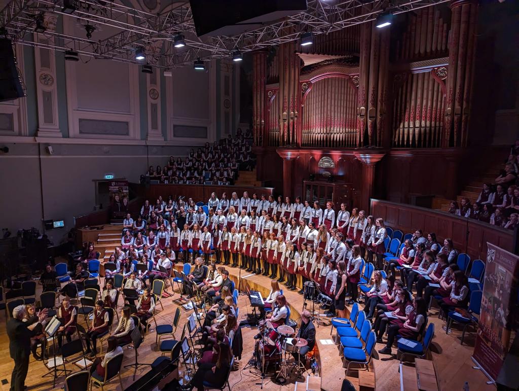 The St Dominic's choirs and musicians on stage in the Ulster Hall