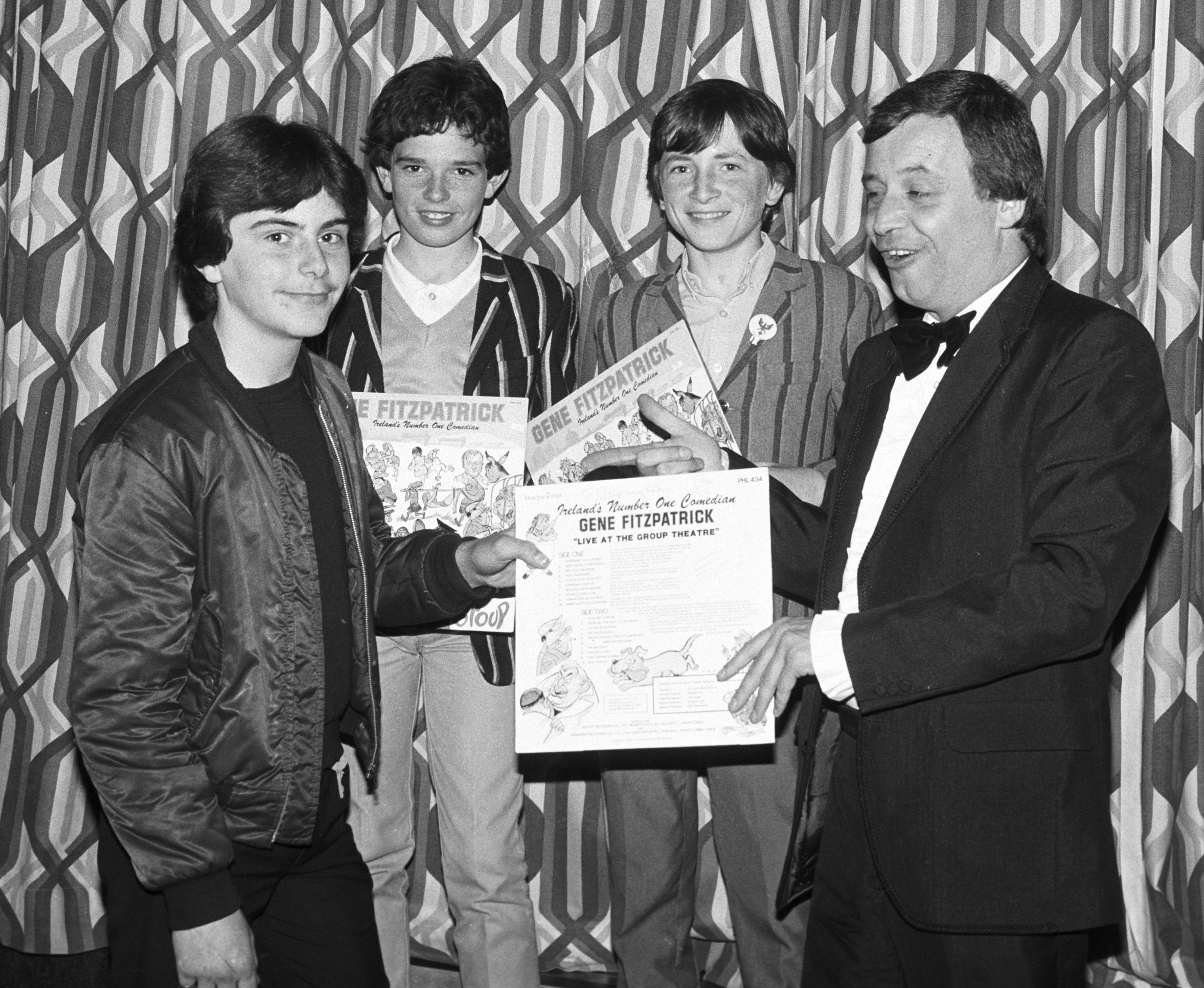 Gene Fitzpatrick presents LPs to winners Phillip Lavery, Paul Lecky and Conor Bradley at St John's GAC Country & Western concert in Andersonstown Leisure Centre