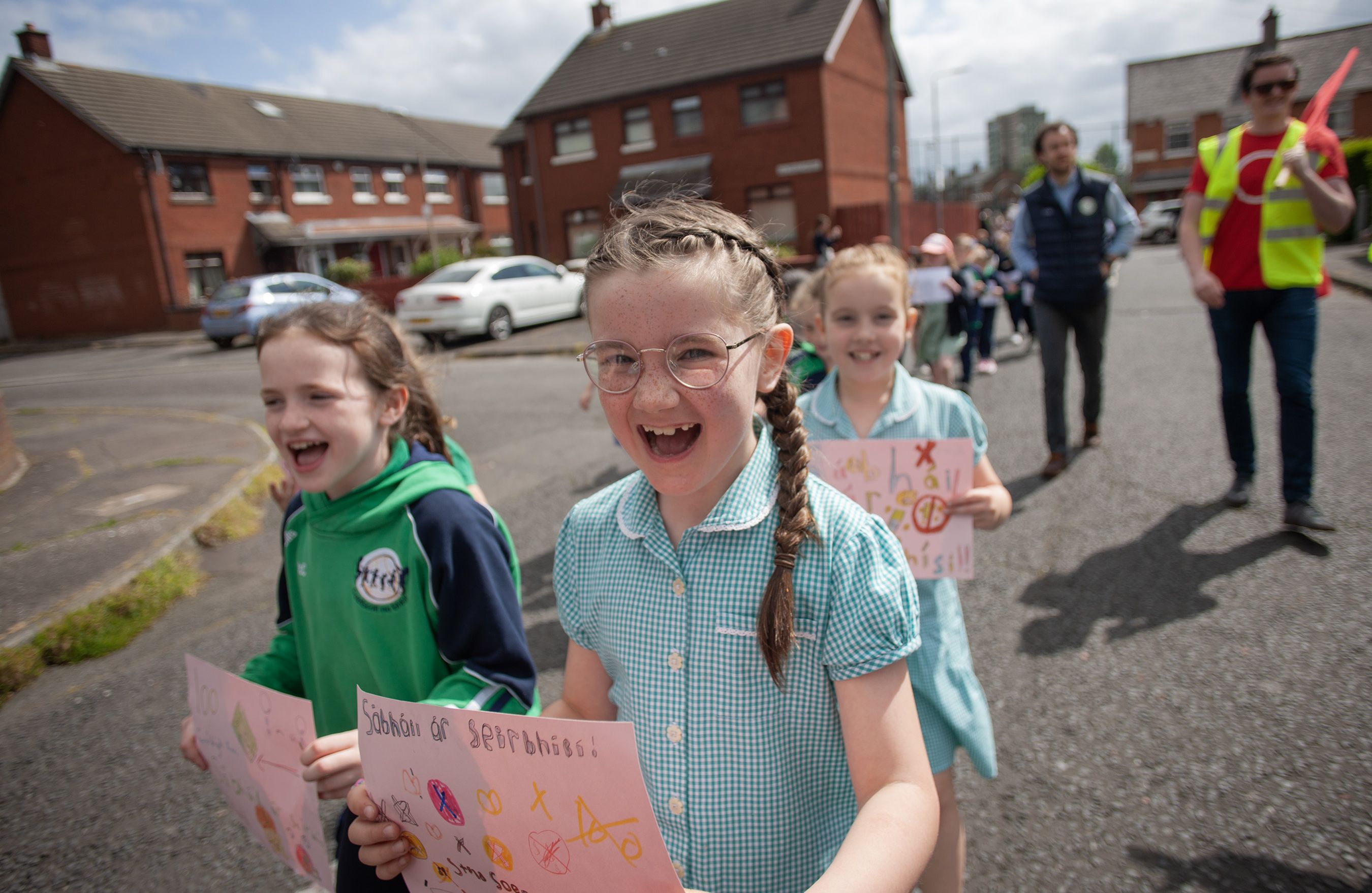 Children holding signs which say 'Save our Services'