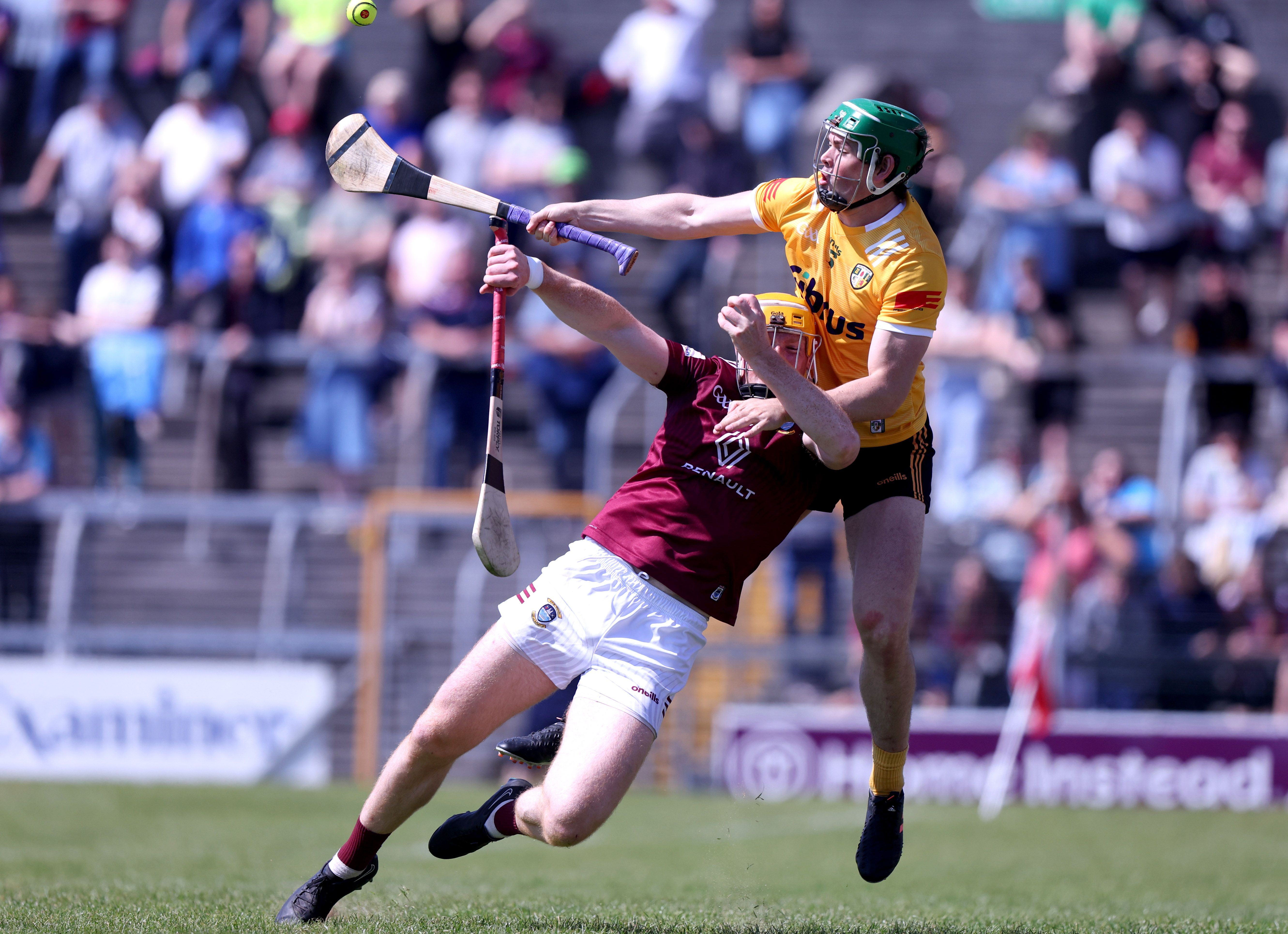 Gerard Walsh beats Niall Mitchell to the ball